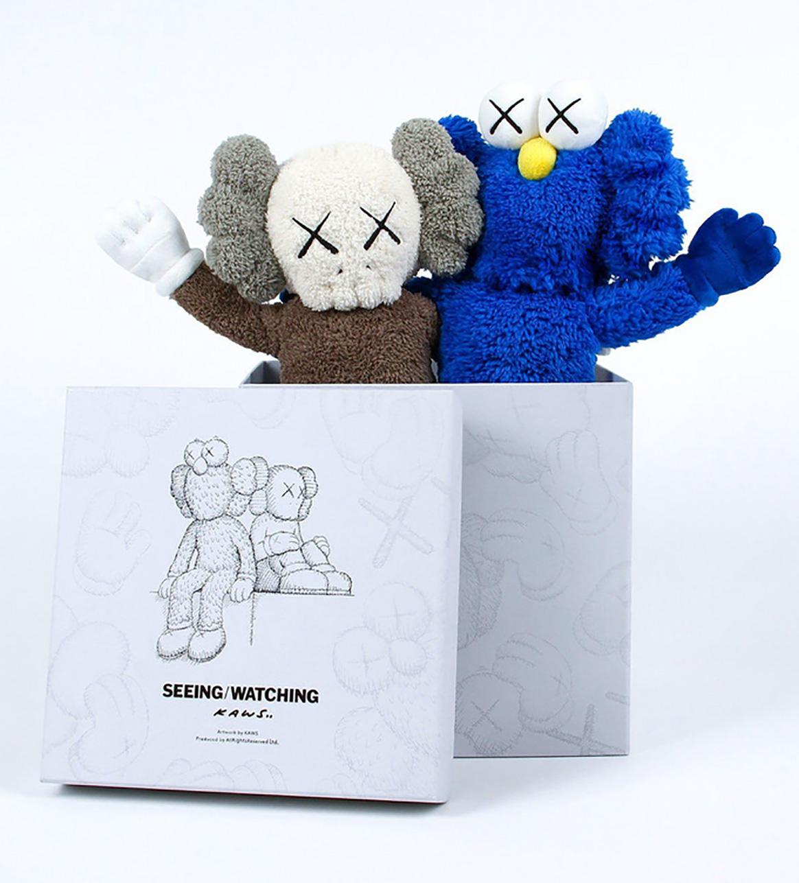 KAWS Seeing/Watching 2018 (KAWS Plush):
New in original packaging accompanied by a numbered tag. Released in conjunction with the installation of the KAWS Seeing/Watching sculpture in Hunan, China. The plush figurines feature the well known