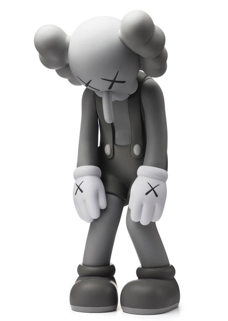 KAWS SMALL LIE Grey:
Among KAWS’s signature “Companions,” Small Lie has the most childlike resonance. Clothed in overall shorts, the Pinocchio-inspired figure bows its head in shame as if hiding from a parent after creating trouble. KAWS debuted