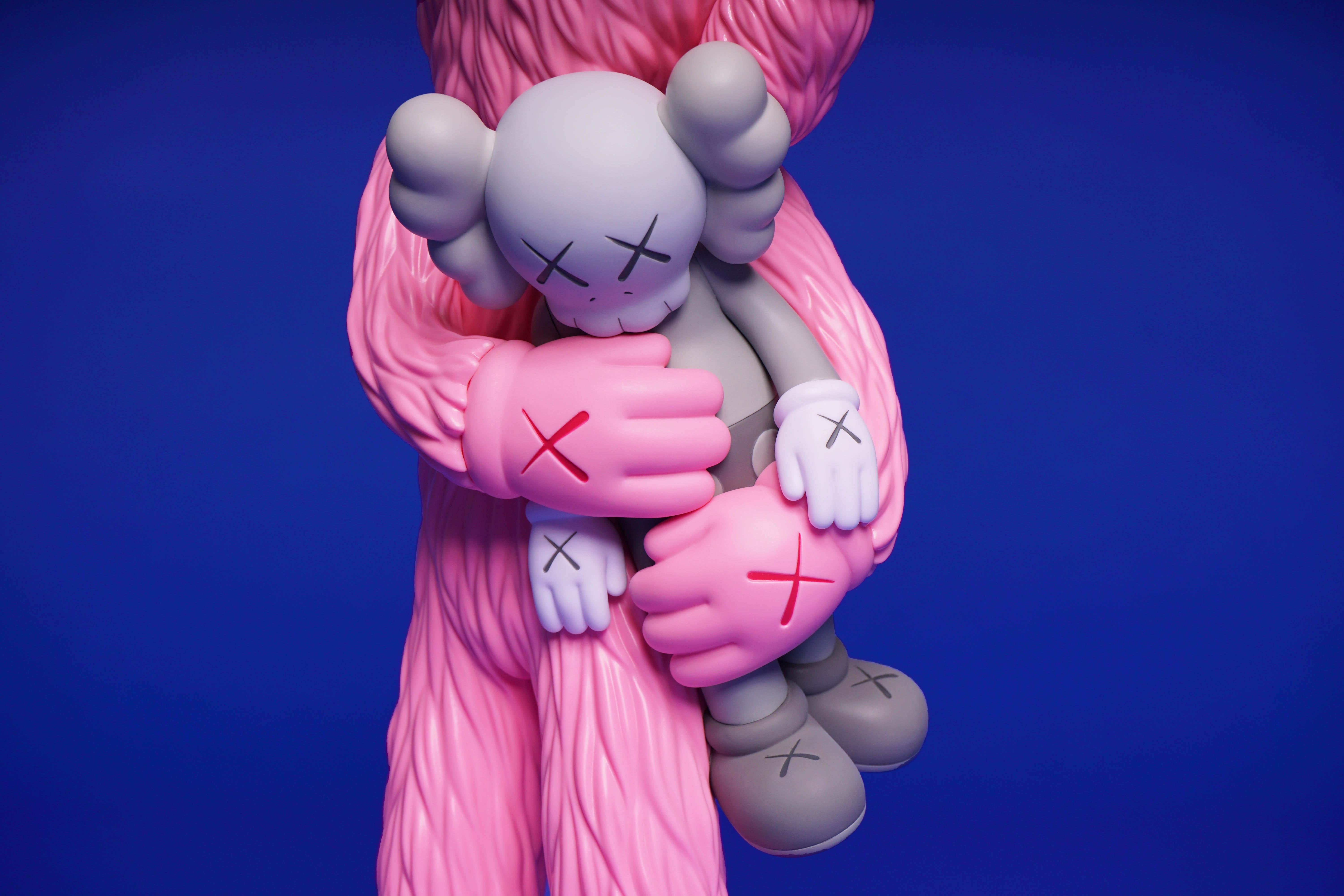 The ‘KAWS TAKE’ is a vinyl millennial pink art toy made in collaboration with Medicom Toy by KAWS. Recently acquired directly from the KAWSONE portal, the instantly sold out vinyl art toy comes with all original boxed packaging in perfect new