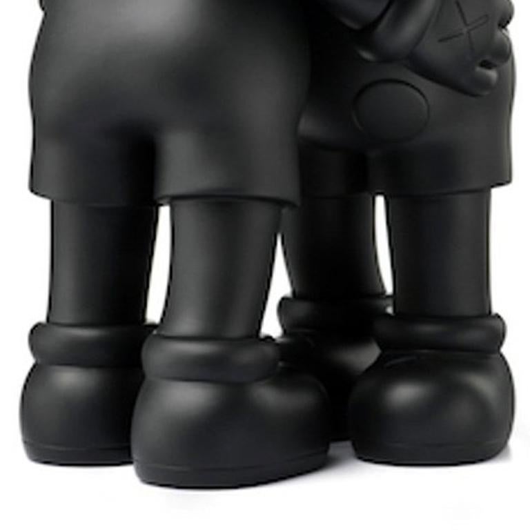 KAWS Black Together Companion 2018:
This rare 2018 KAWS TOGETHER features the artist's iconic “Companions” interlocked in a permanent hug. KAWS first debuted this embracing Together duo in 2016, presenting the large-scale wooden versions at More