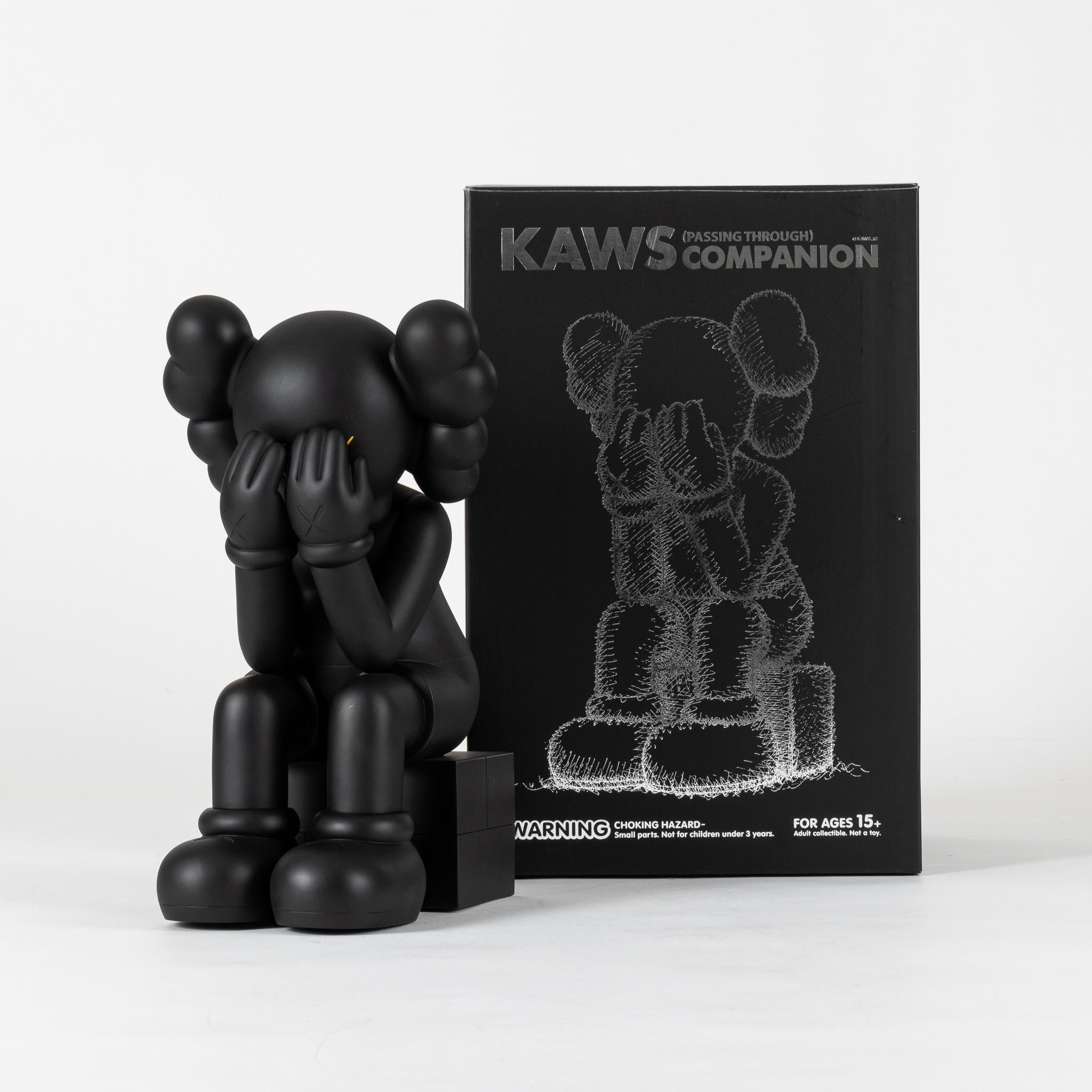 kaws statues