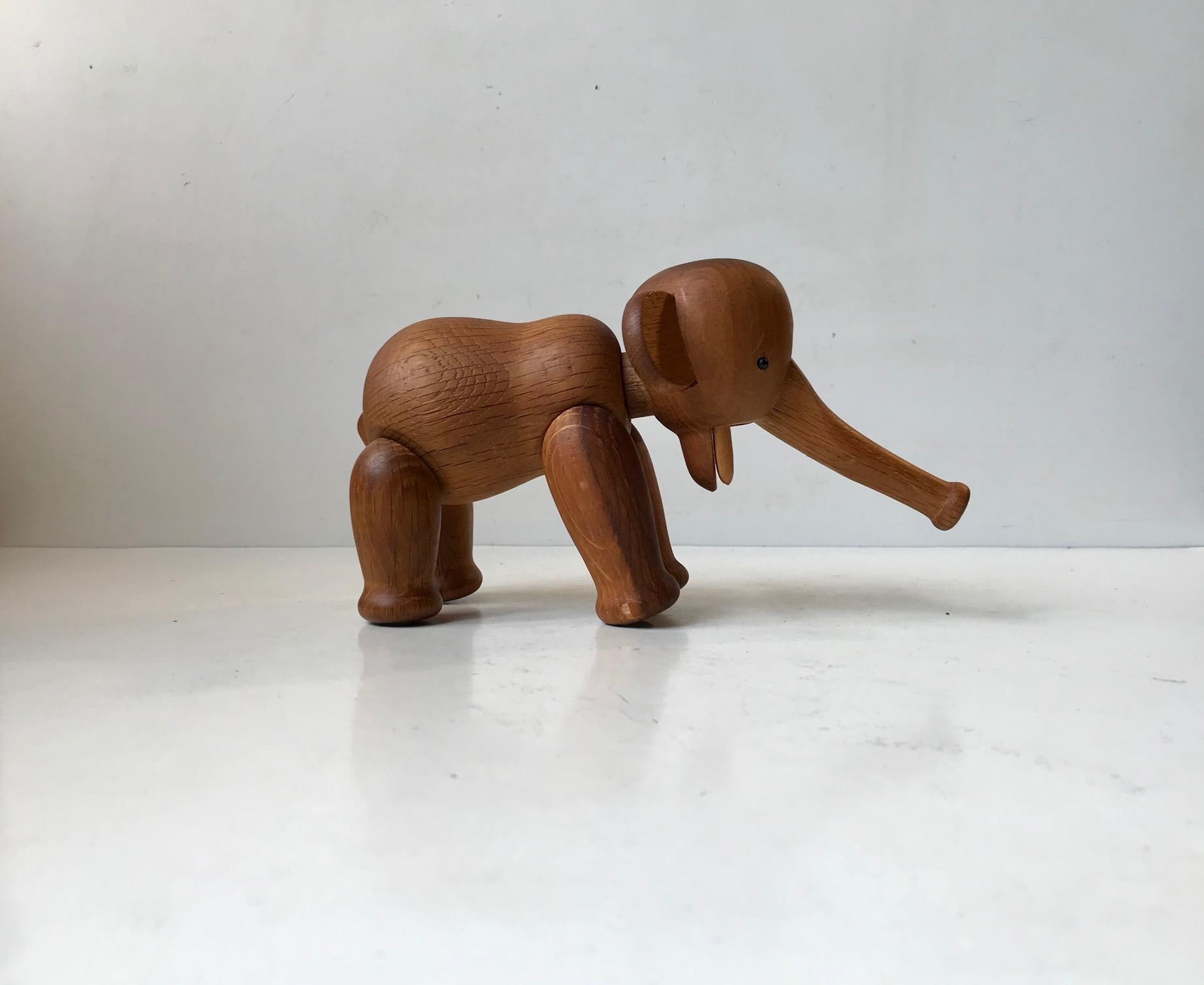 Early elephant designed by Kay Bojesen in 1953. Its made from solid oak and features articulated limbs, legs, trunk and a removable head. This is an early example made between 1955-57 indicated by the ovale burn-marking to one foot. Truly a Museums