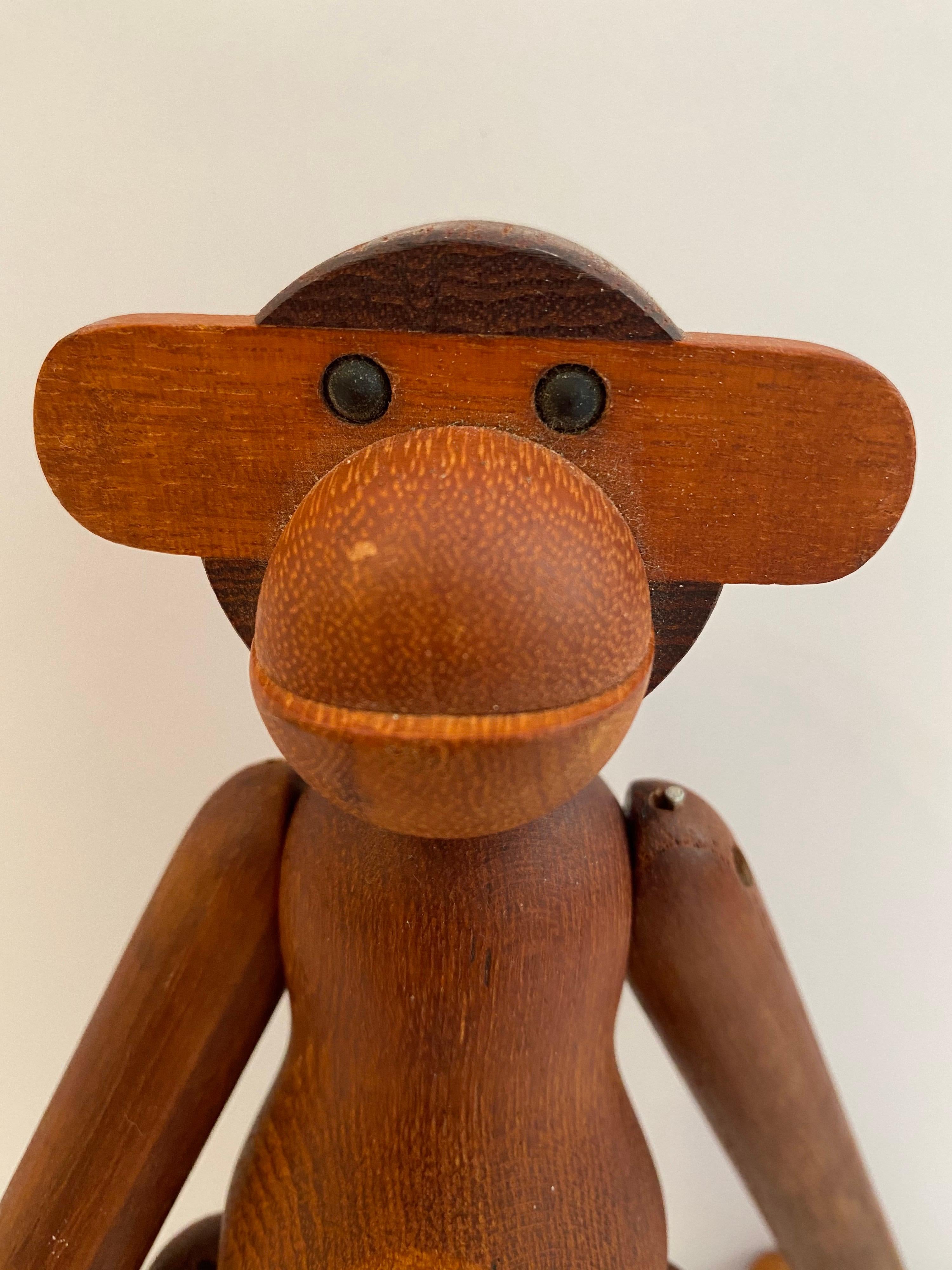 Kay Bojesen articulating and jointed teak monkey. Bought from the original owner who had it in the early 1960's. At some point in the last 15 years he had his rubber bands replaced properly. Nice color and patina to the wood! Signed on bottom of one