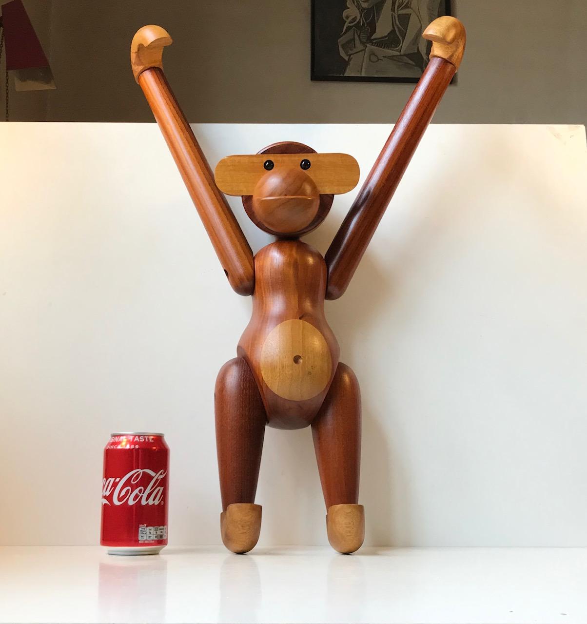 Iconic articulated teak and limba monkey designed by Kay Bojesen, Denmark. This is the large version measuring 58 cm/23 inches when standing fully articulated. It was designed in 1952 this one is an example from the 1980s. Very good vintage