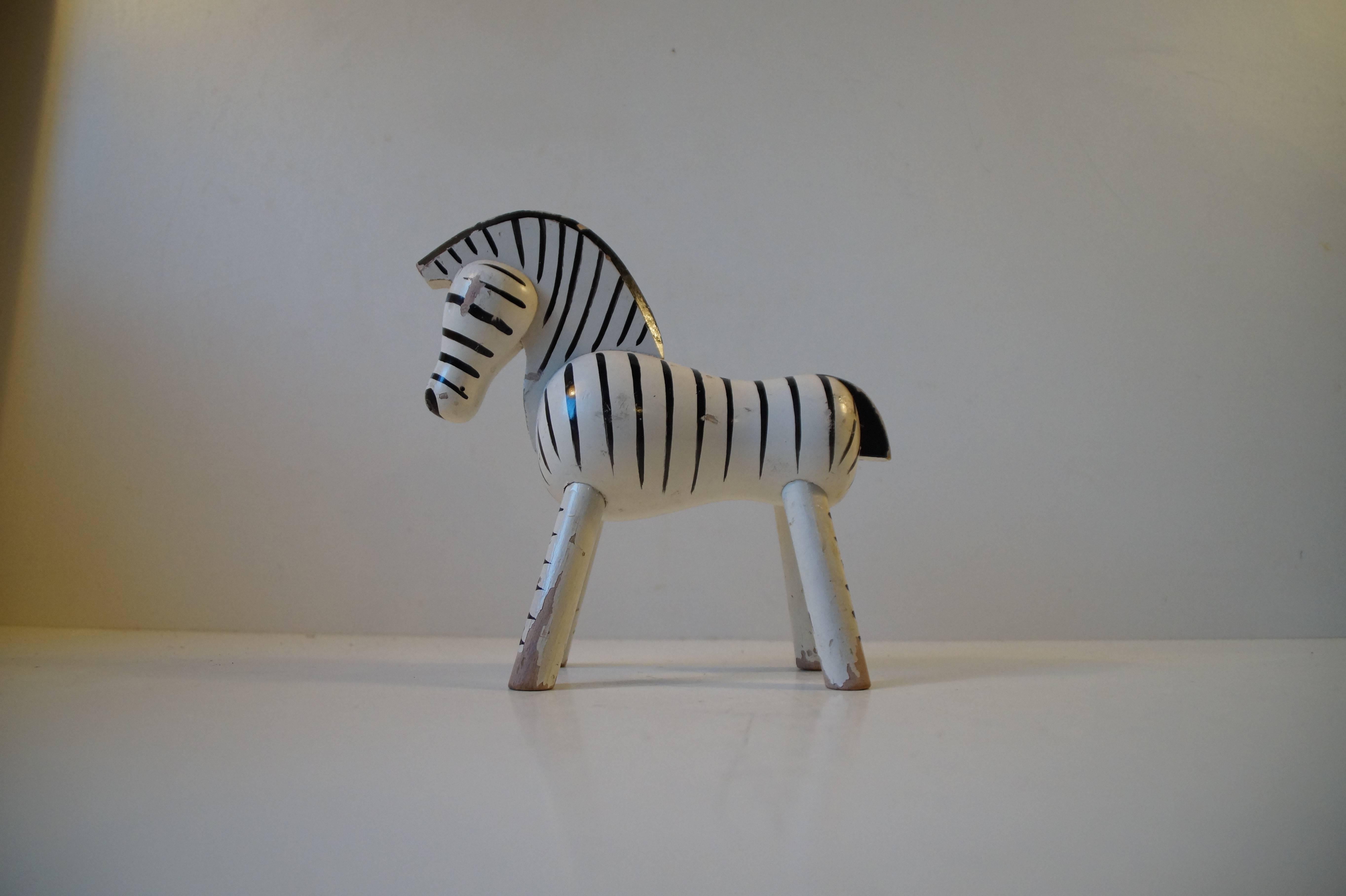 Type: Wooden toy zebra, Figurine. Material: Beech. Color: White and black.
Design: Kay Bojesen. Origin: Denmark. Period: Manufactured in the 1950s (Designed in 1935). Measurements: Height: Approximately 14 cm (5.6 inch). Length: Approximately 15 cm