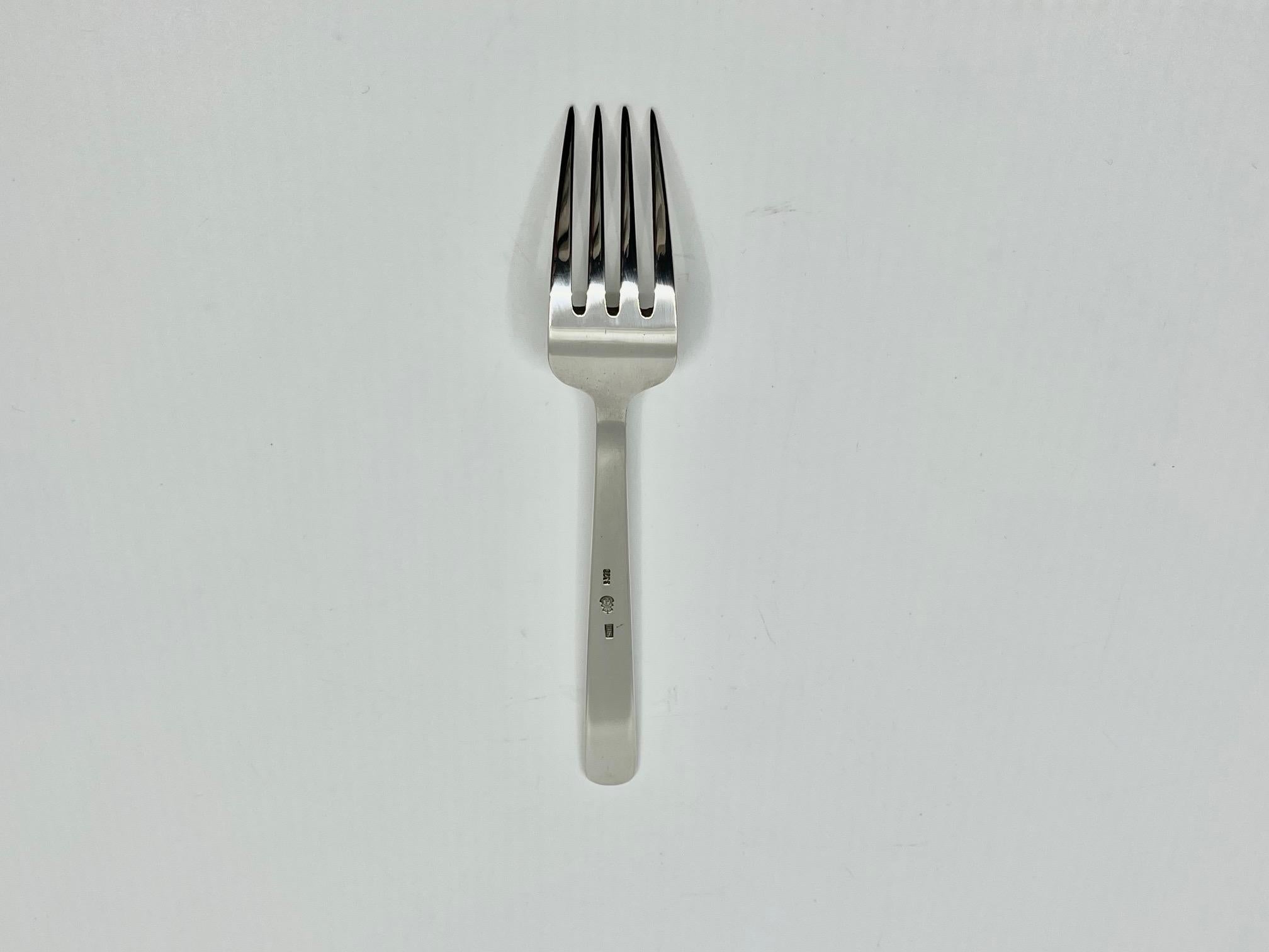 A sterling silver lunch/salad fork in the Grand Prix pattern, designed by Kay Bojesen in 1938.

Additional information:
Material: Sterling silver
Styles: Modern
Hallmarks: Marked with the Kay Bojesen buoy logo and “925S KBS”.
Dimensions: Measures 6