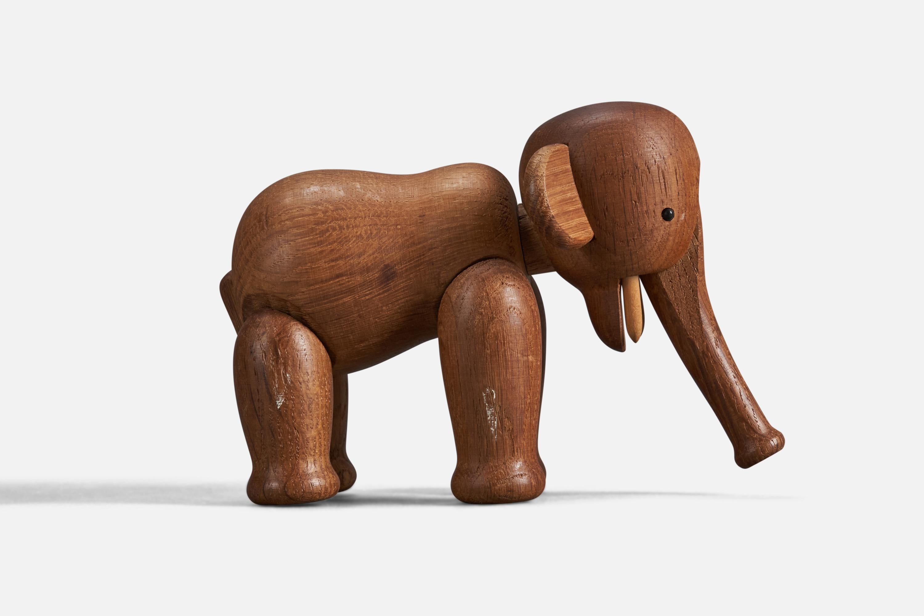A teak toy or animal sculpture designed by Kay Bojesen, Denmark, 1950s.

Dimensions variable, measured as illustrated in first image.