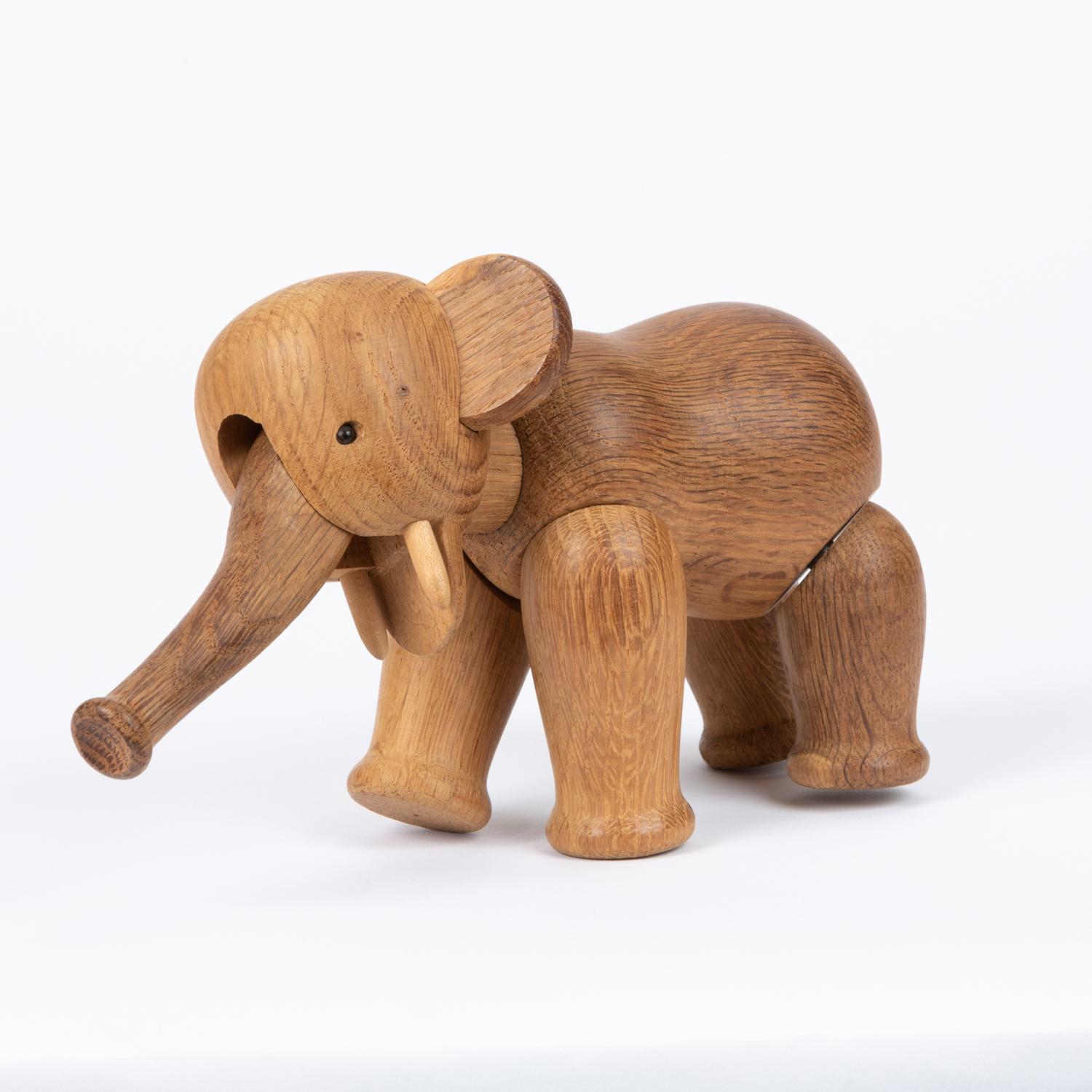 An original wooden elephant figurine by Kay Bojesen, Denmark, circa 1960s. The figurine consists of multiple hand carved oak pieces that form a Kinetic sculpture with multiple freeform movements. Marked 