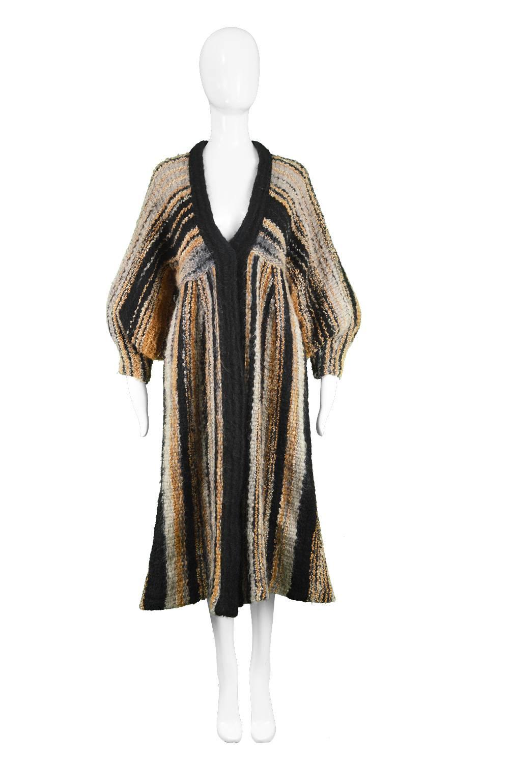 Kay Cosserat Vintage 1970s Wool & Mohair Boucle Knit Balloon Sleeve Cardigan Coat

Estimated Size: Women's Small to Medium depending on desired fit.
Bust - Free due to batwing sleeves
Waist - 32” / 81cm 
Hips - 44” / 112cm
Length (Shoulder to Hem) -