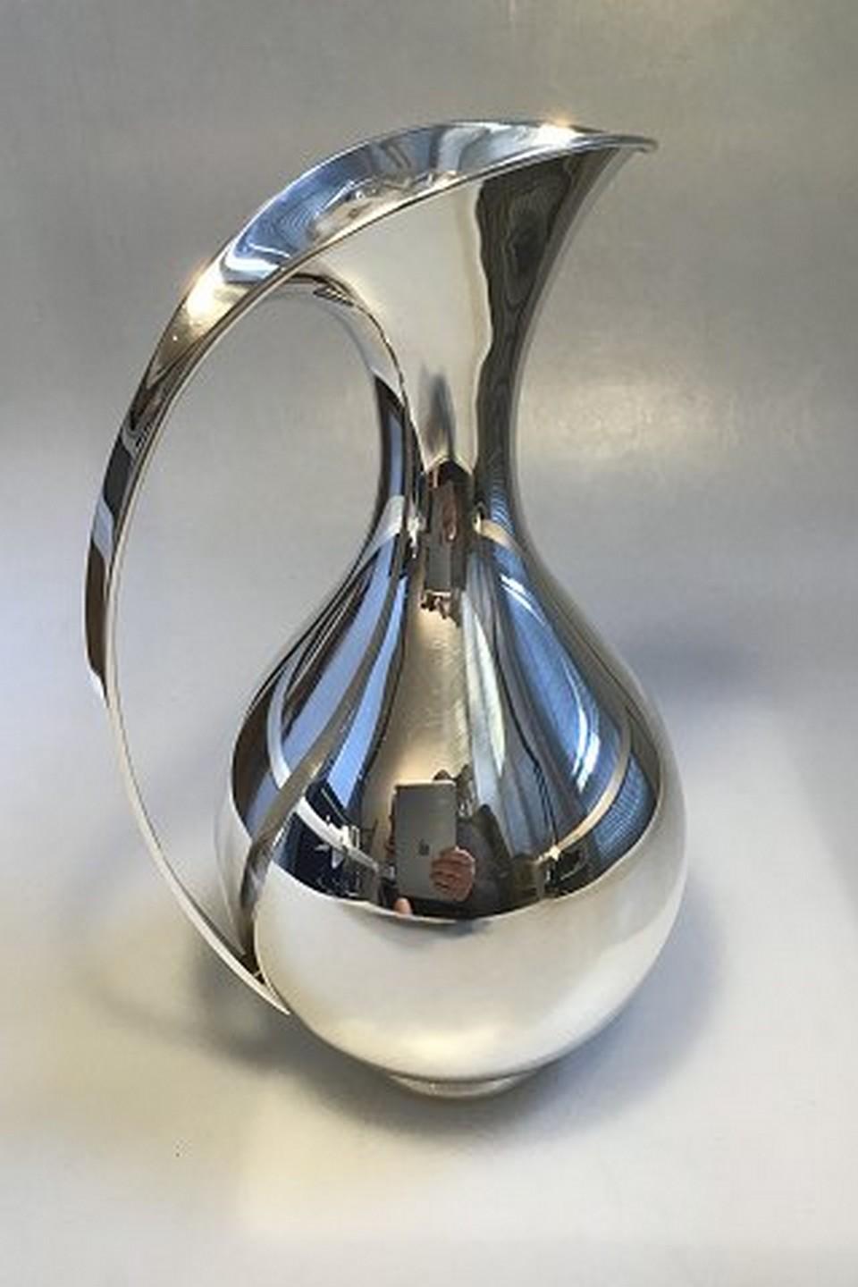 Kay Fisker Anton Michelsen sterling silver pitcher. 
Measures: 26.5 cm / 10 7/16 in. 
Weighs 773 g / 27.27 oz.
Item no.: 450572.
  