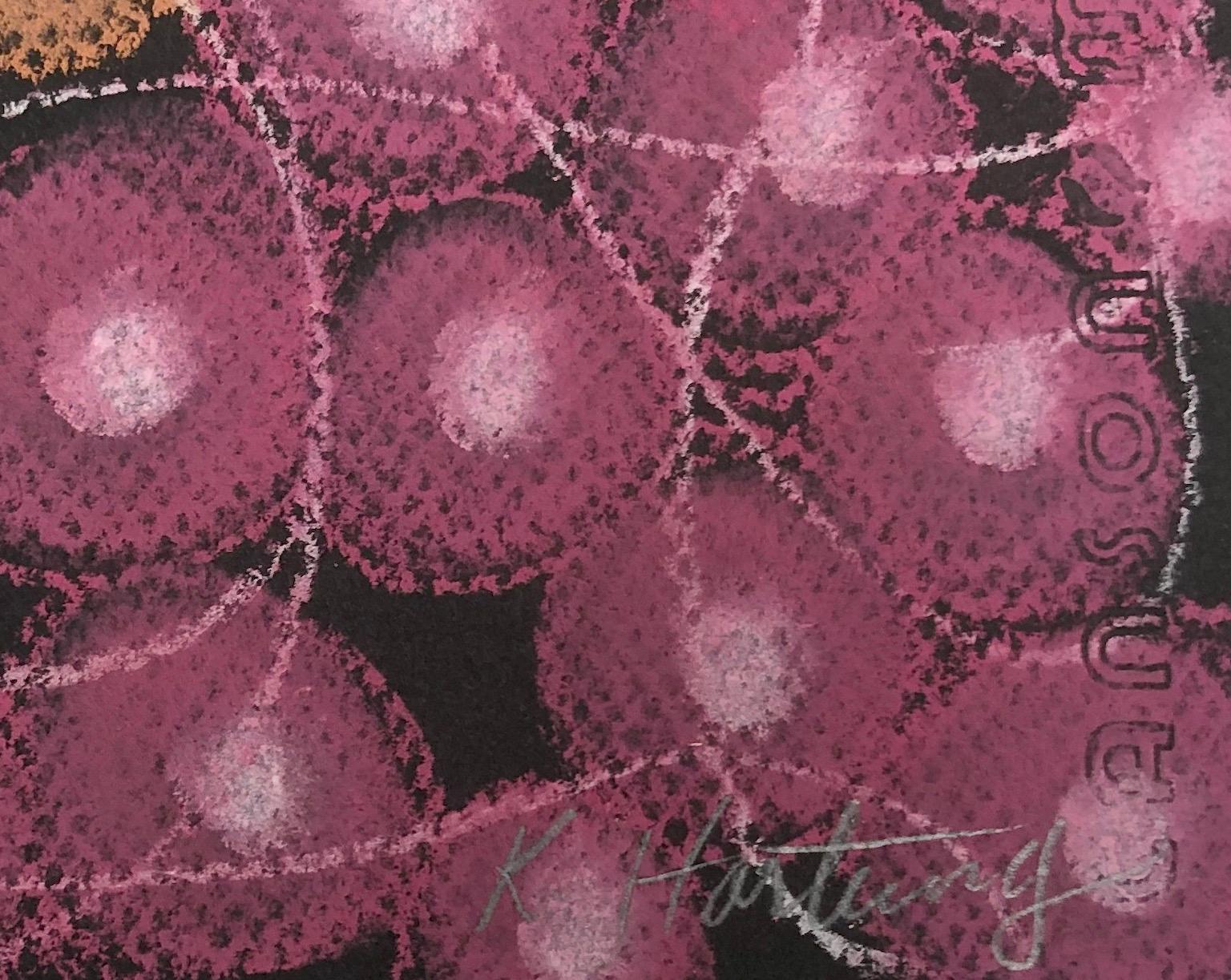 Kay Hartung’s “Microbial Gathering 1” is a 19.5 x 25 inch pastel drawing done on black Canson Mi Teintes paper. In colors of orange, pink, purple and white, the drawing is richly detailed with broad areas of color as well as fine lines. The use of