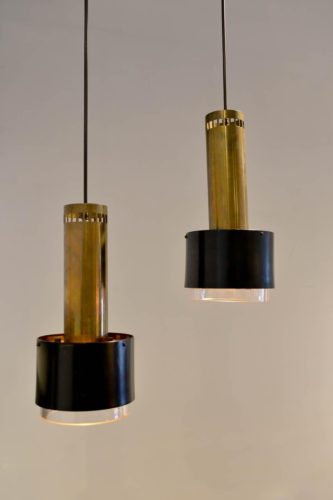 Kay Korbing for Lyfa Denmark pendant lights, circa 1960. Newly rewired to UL standards. Made of enameled steel, brass and glass in good vintage condition.

Measures: 13.25