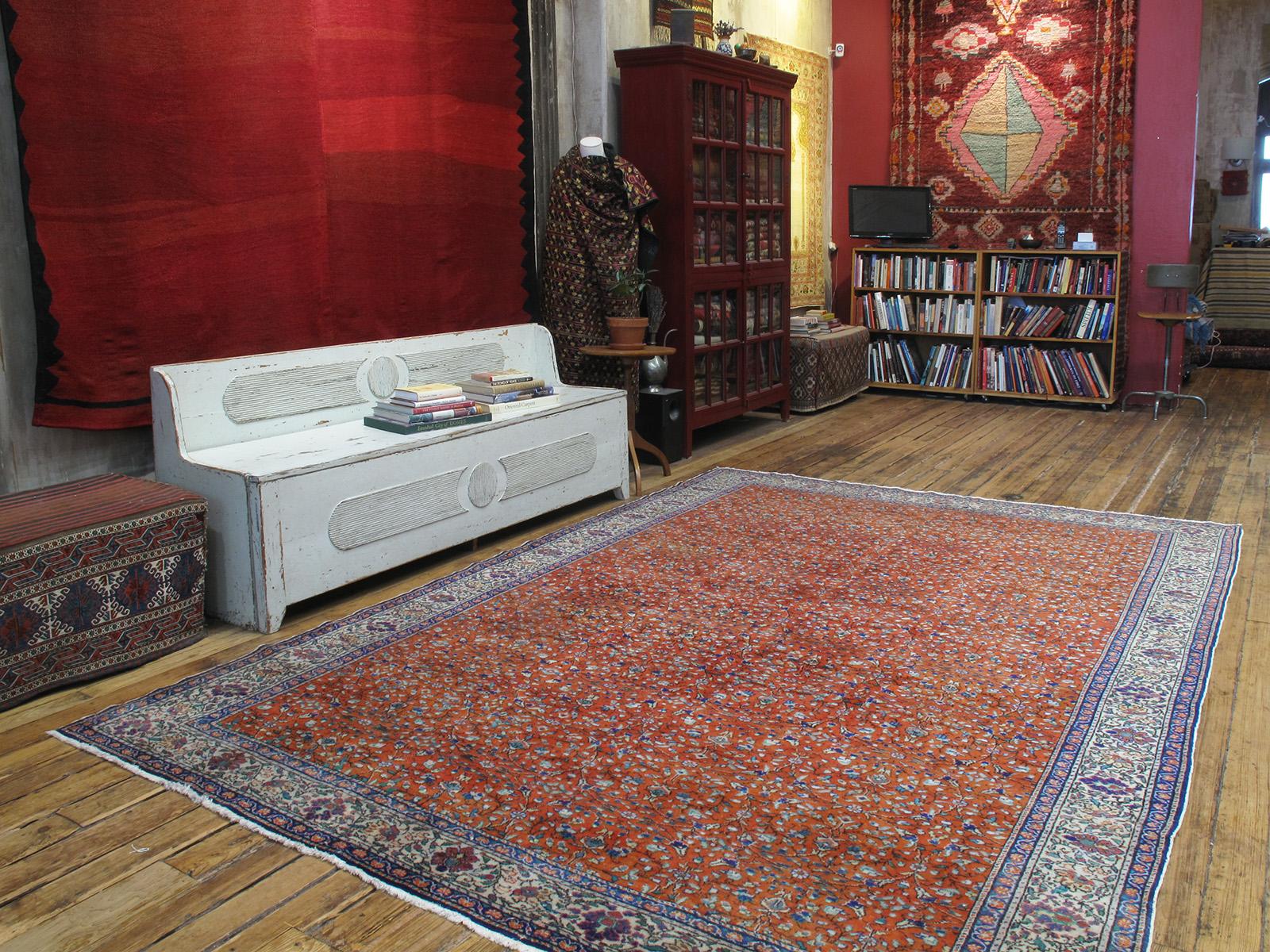 A classical beauty - an old carpet from Central Turkey with a small pattern floral design, rendered on a very pleasing burnt orange background.

Carpets like these were woven for the local Turkish market rather than export, often to much higher