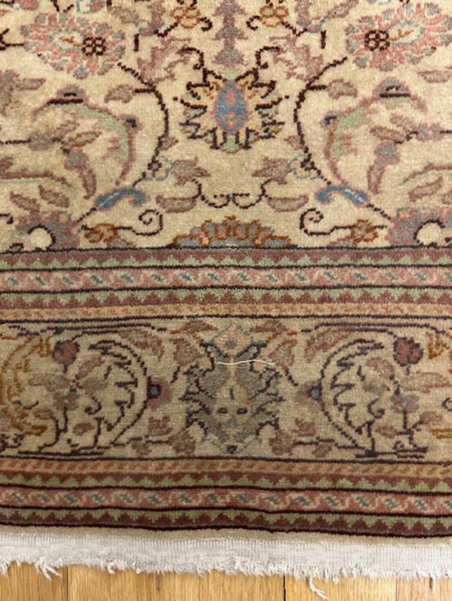 Kayseri rug from central Anatolia (Turkey)

Age: circa 1950

Size: 5′.10″x3′.11″ (178×119 cm)

The cream field hosts a repeating overall Persianate palmette pattern with smaller connecting vine segments and jagged leaves.The bottom part of the field