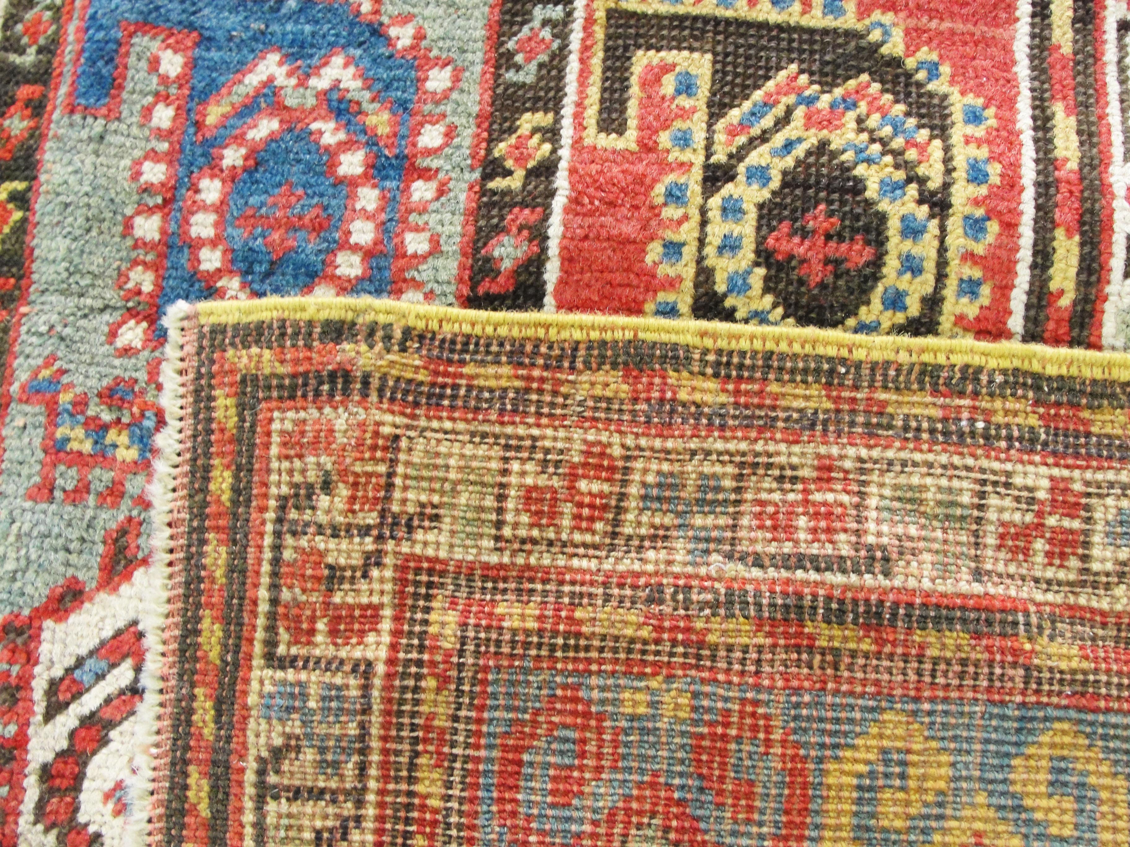 Highly unusual design antique colorful Kazak rug.
The Caucasus is bounded by the rugged mountains and lush valleys of Armenia, Azerbaijan and Georgia. This cultural melting pot was populated by Armenian dyers and weavers, Azeri Turks, groups from