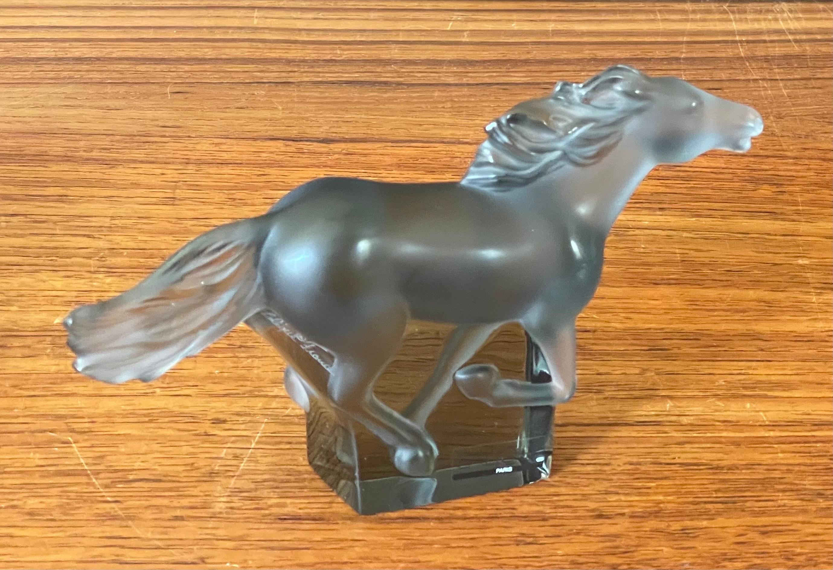 Kazak horse galloping / stallion sculpture in transparent grey crystal by Lalique of France, circa 1990s. The piece is in very good vintage condition with no chips or cracks and measures 7