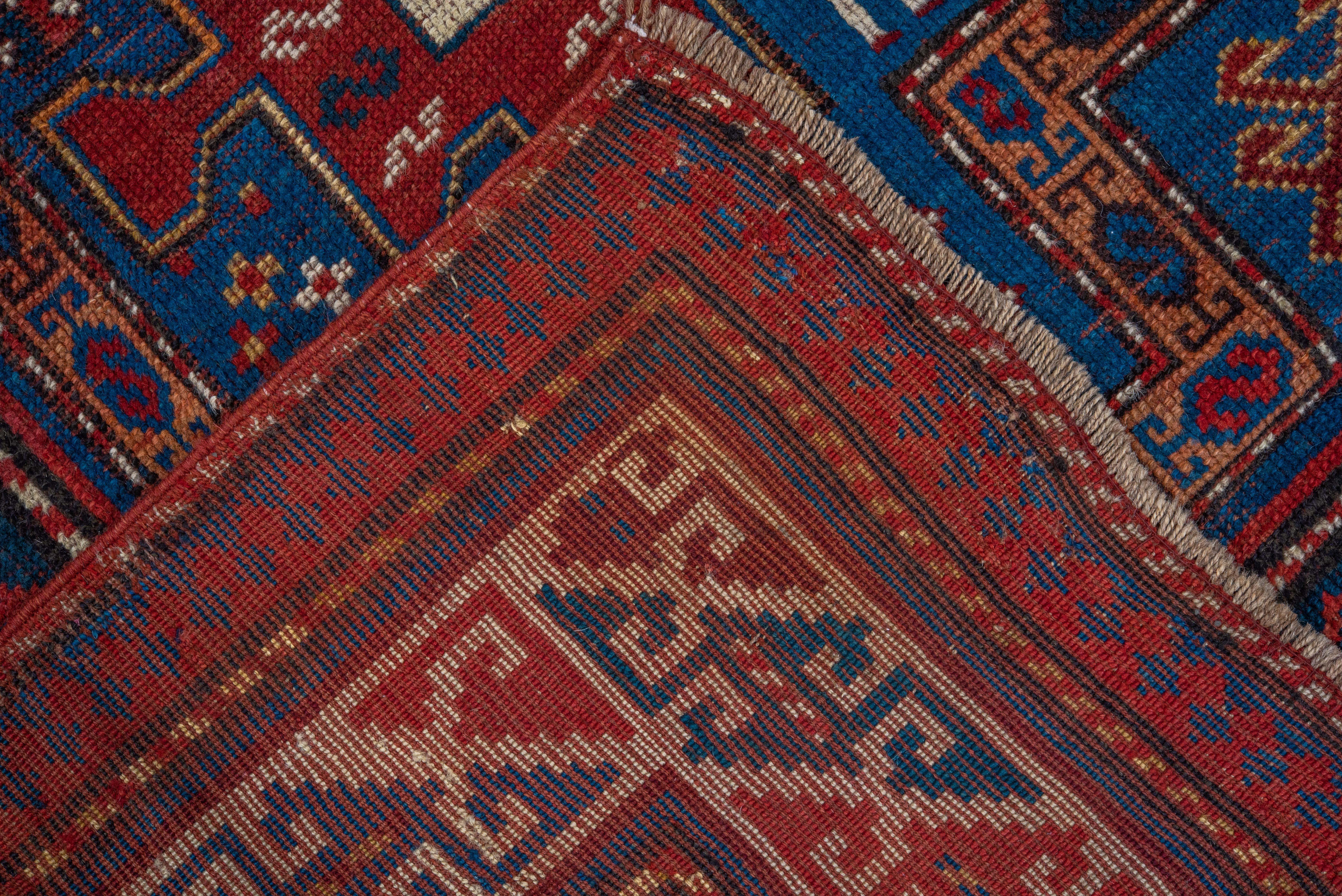 Hand-Knotted Kazak In Rich Blues and Reds  For Sale
