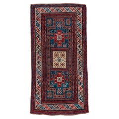 Antique Kazak In Rich Blues and Reds 