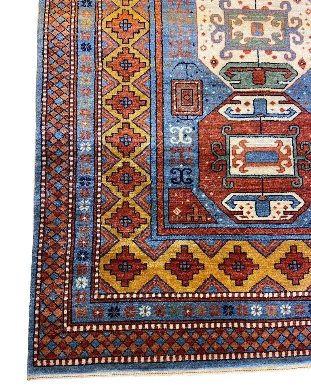 Vegetable Dyed Kazak-Inspired Tribal Wool Rug in Red, Blue, Yellow, and Cream, 4' x 6' For Sale