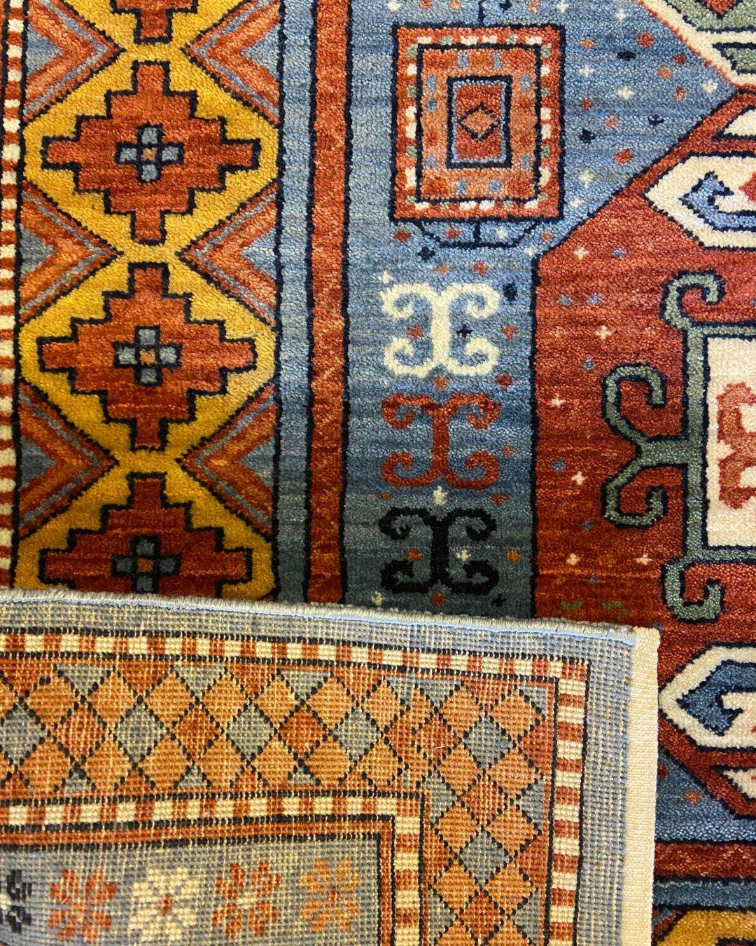 Contemporary Kazak-Inspired Tribal Wool Rug in Red, Blue, Yellow, and Cream, 4' x 6' For Sale