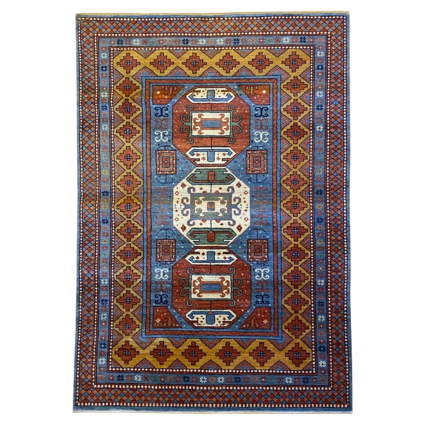 Kazak-Inspired Tribal Wool Rug in Red, Blue, Yellow, and Cream, 4' x 6'
