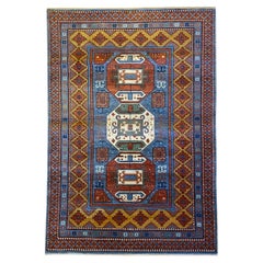 Kazak-Inspired Tribal Wool Rug in Red, Blue, Yellow, and Cream, 4' x 6'