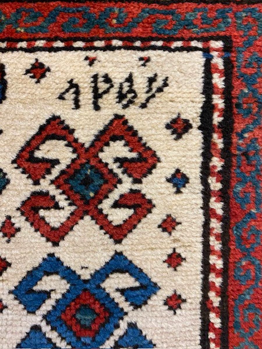 Kazak prayer rug from southwest Caucasus

Age: dated 1292= 1875

Size: 5′.3″x3′.1″ (160×94 cm)

This attractive Kazak rug displays a nested and hooked diamond medallion above a square,nested panel.There are rows of colorful