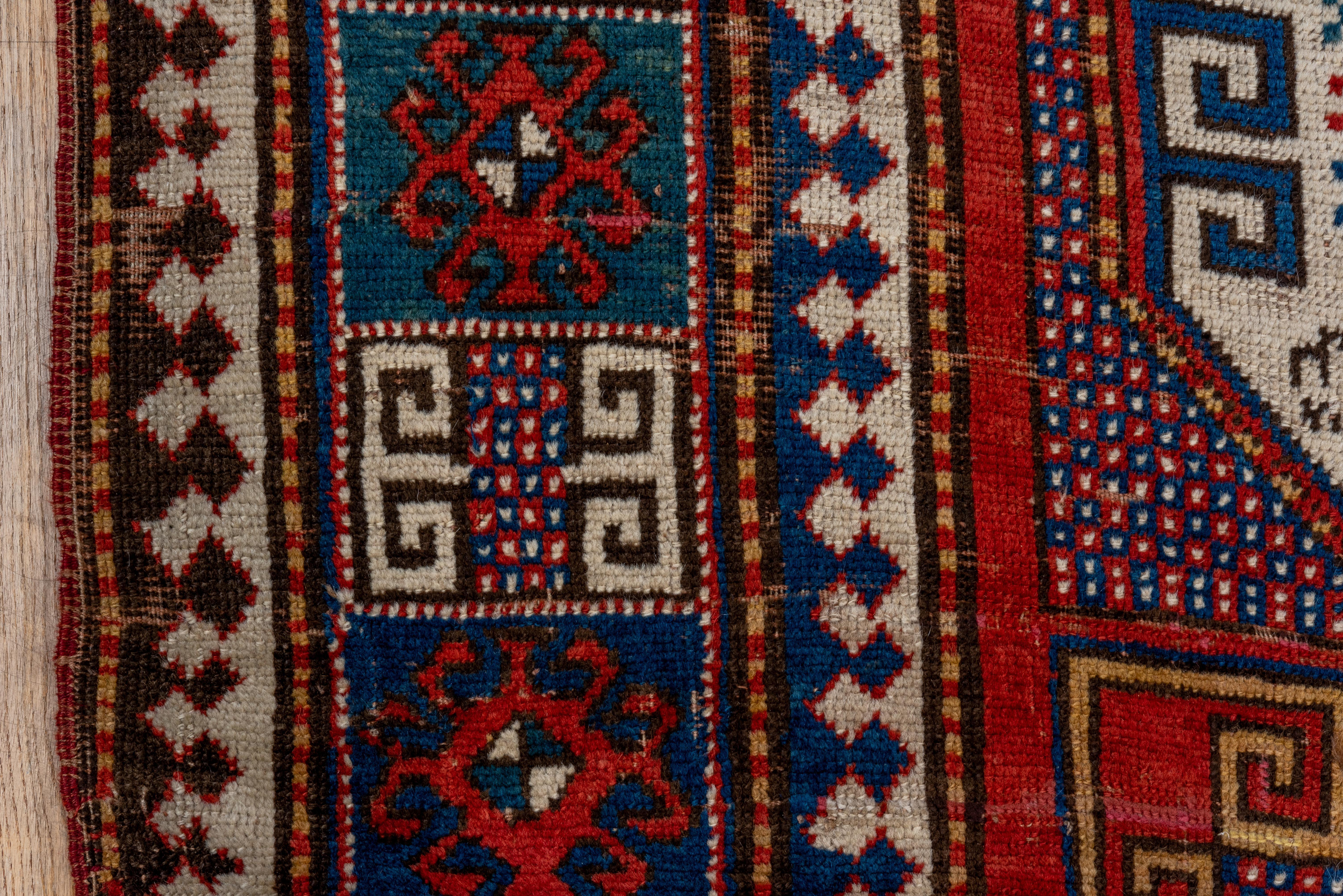 Wool Kazak Rug Octagon Medallion and Geometric Panel Design For Sale