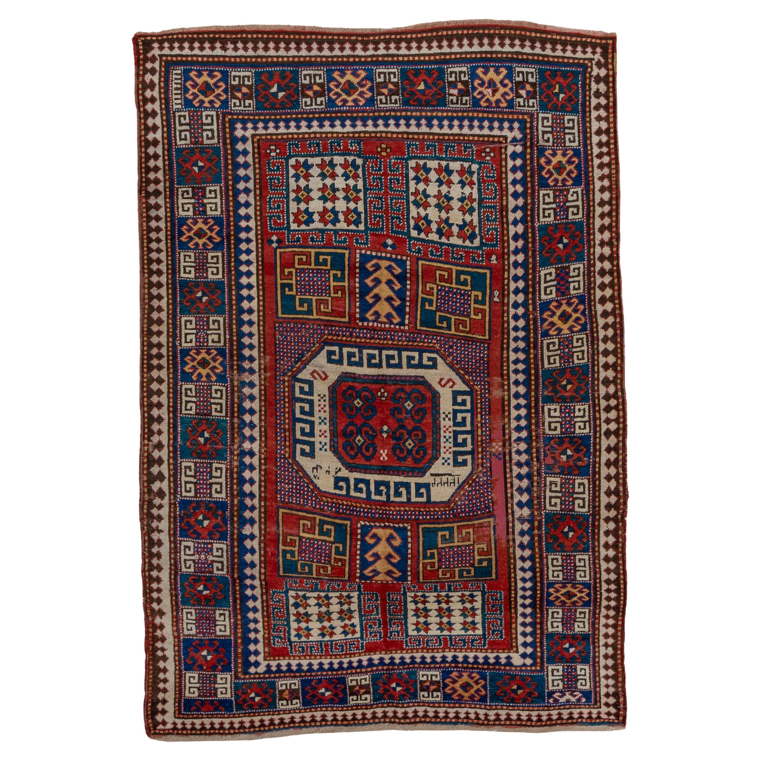 Kazak Rug Octagon Medallion and Geometric Panel Design For Sale
