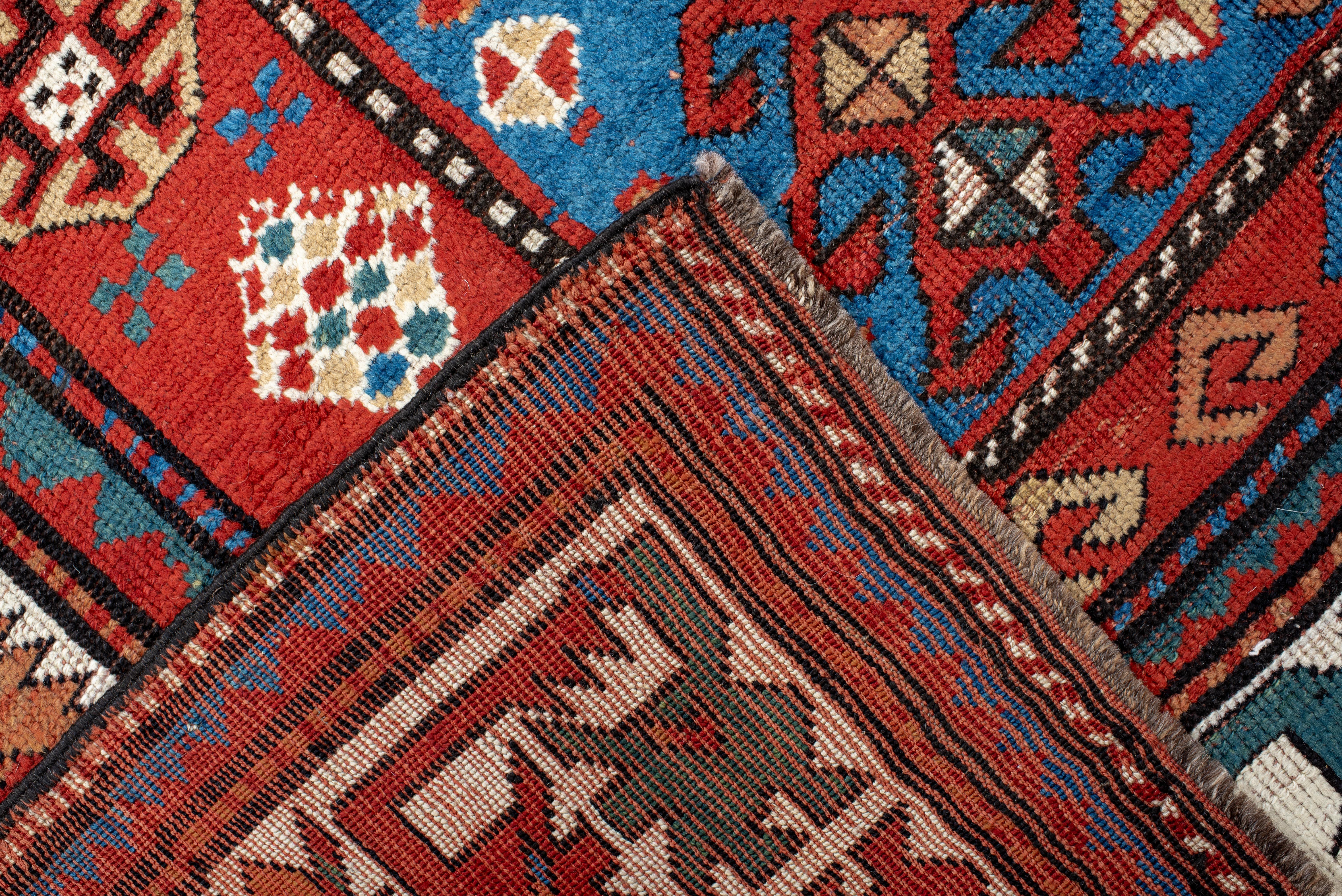 20th Century Kazak Rug Tribal Medallion and Hooked Motif Design For Sale