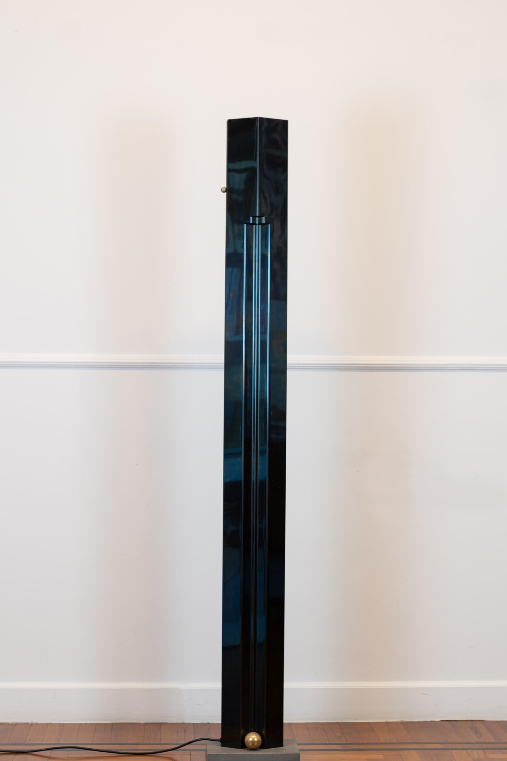 Totem floor lamp design by Kazuhide Takaham for Sirrah, 1982, Italy.
The body is galvanized stainless steel in blue iridescent surface finish, and the base in sandstone.
Manufacturer Brand under the base.

Literature: Domus n. 638, April 1983,