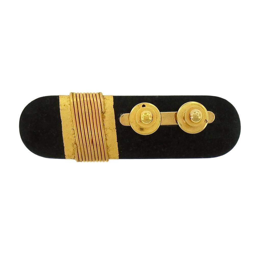 From a private collection, extremely rare work from Japanese modernist Kazuhiro Itoh (1948-1997), an elongated oval brooch of polished  granite wrapped in 22K gold wire and 24K gold leaf,  sterling silver pin back, made in 1979.  Measures 2-3/4