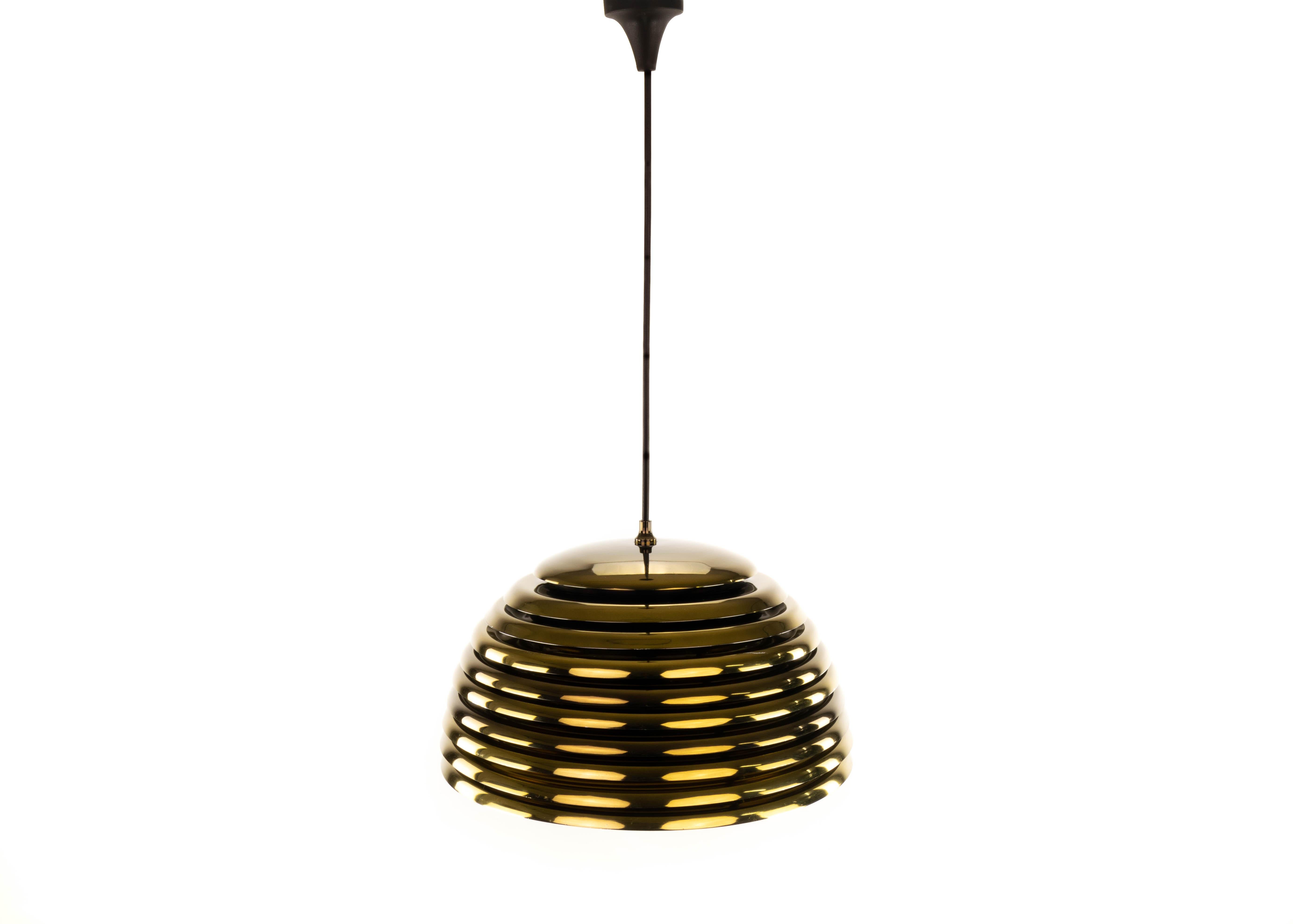 Golden Saturn pendant lamp. Exceptional and rare piece, designed by Kazuo Motozawa in 1972 for Staff, Germany.
Brassed steel construction.

Measurements:
Total height 110 cm
Height of the body 25 cm
Diameter 40 cm.
 