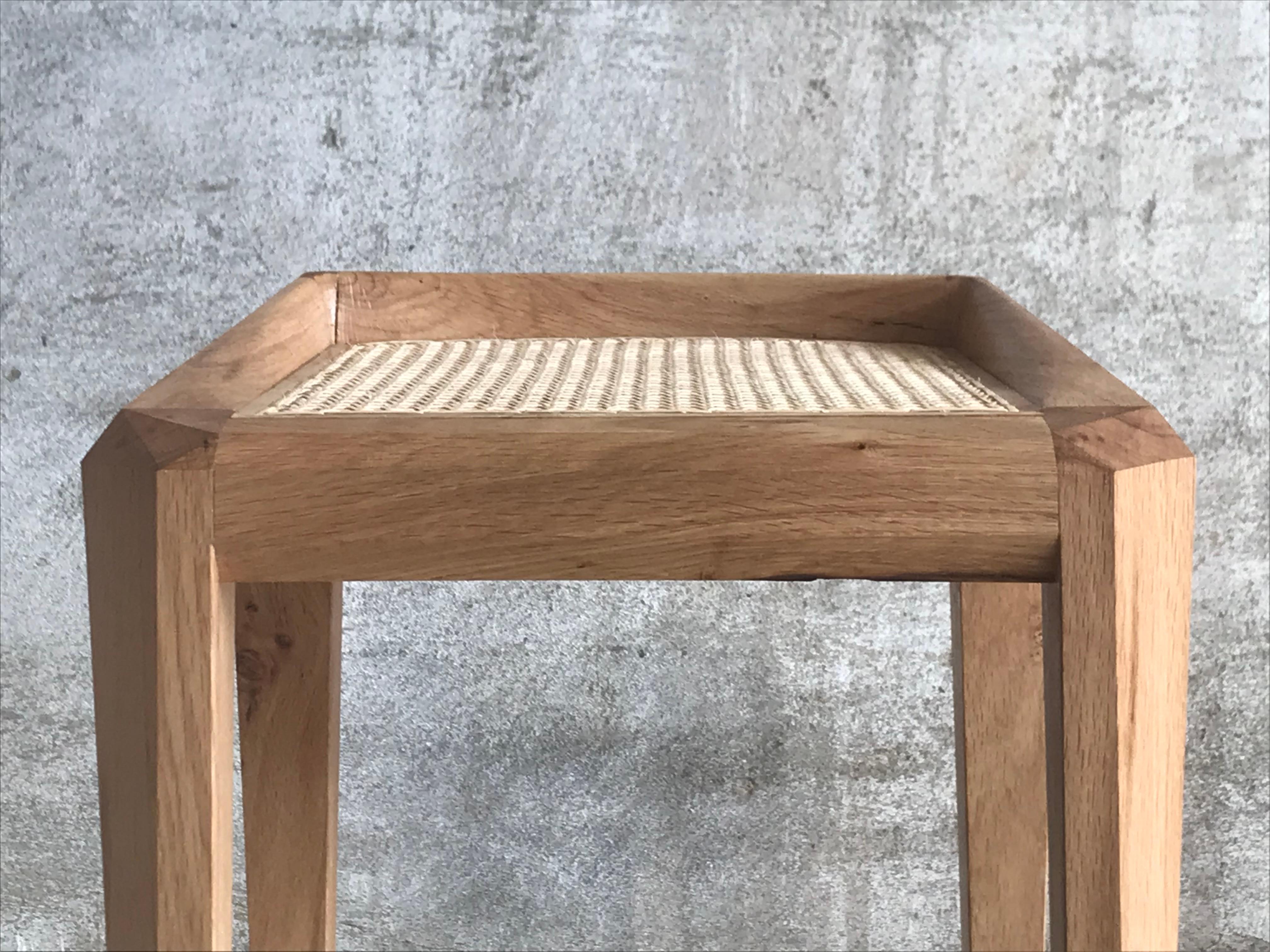 This carefully designed and handcrafted contemporary bar stool with a rattan weaved seat is an elegant and sophisticated stool for a kitchen or home bar, designed and made by Tomaz Viana.
Its geometrical side view was designed as a playful visual