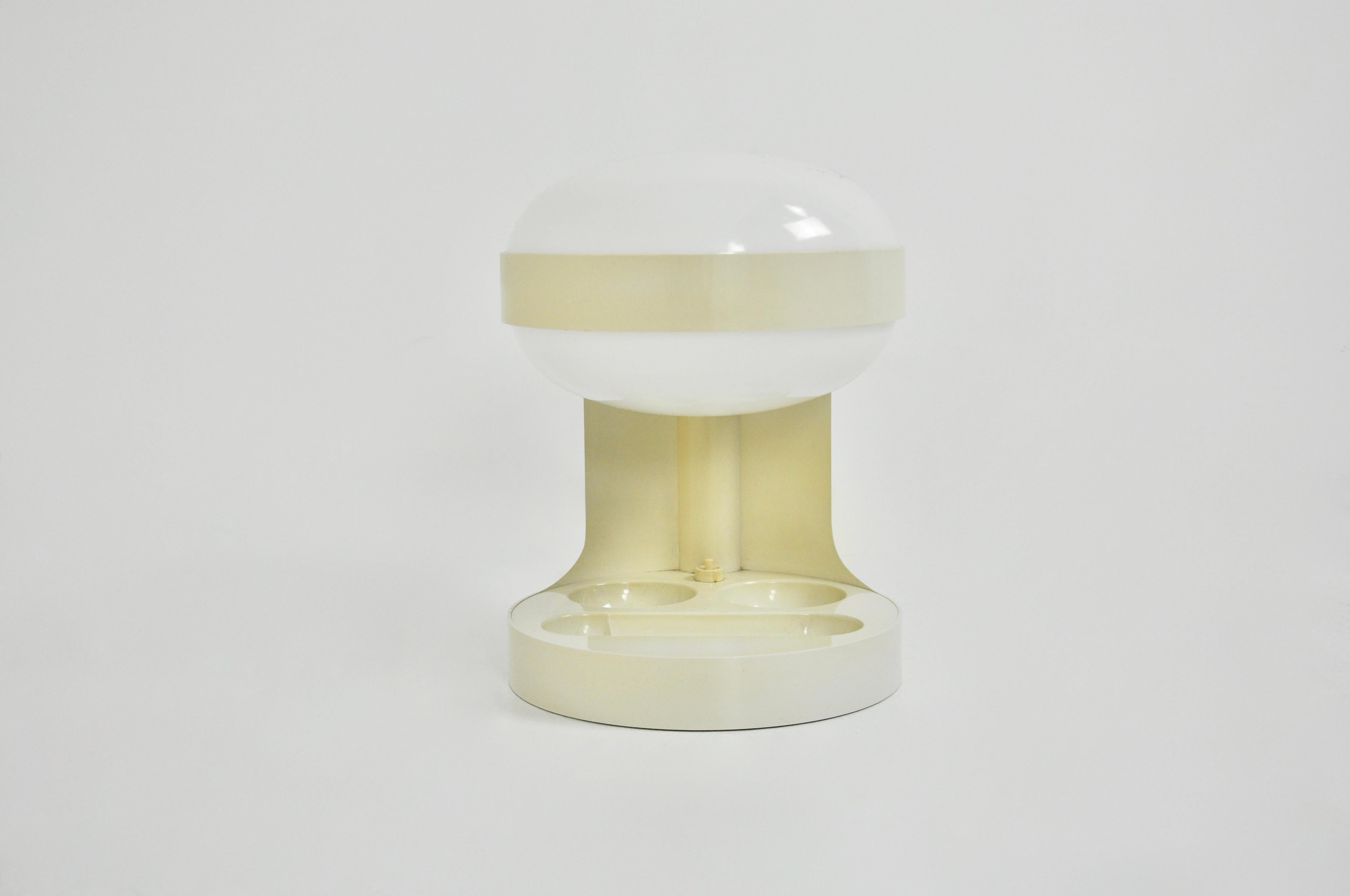 Plastic lamp of white color. Wear due to time and the age of the lamp.