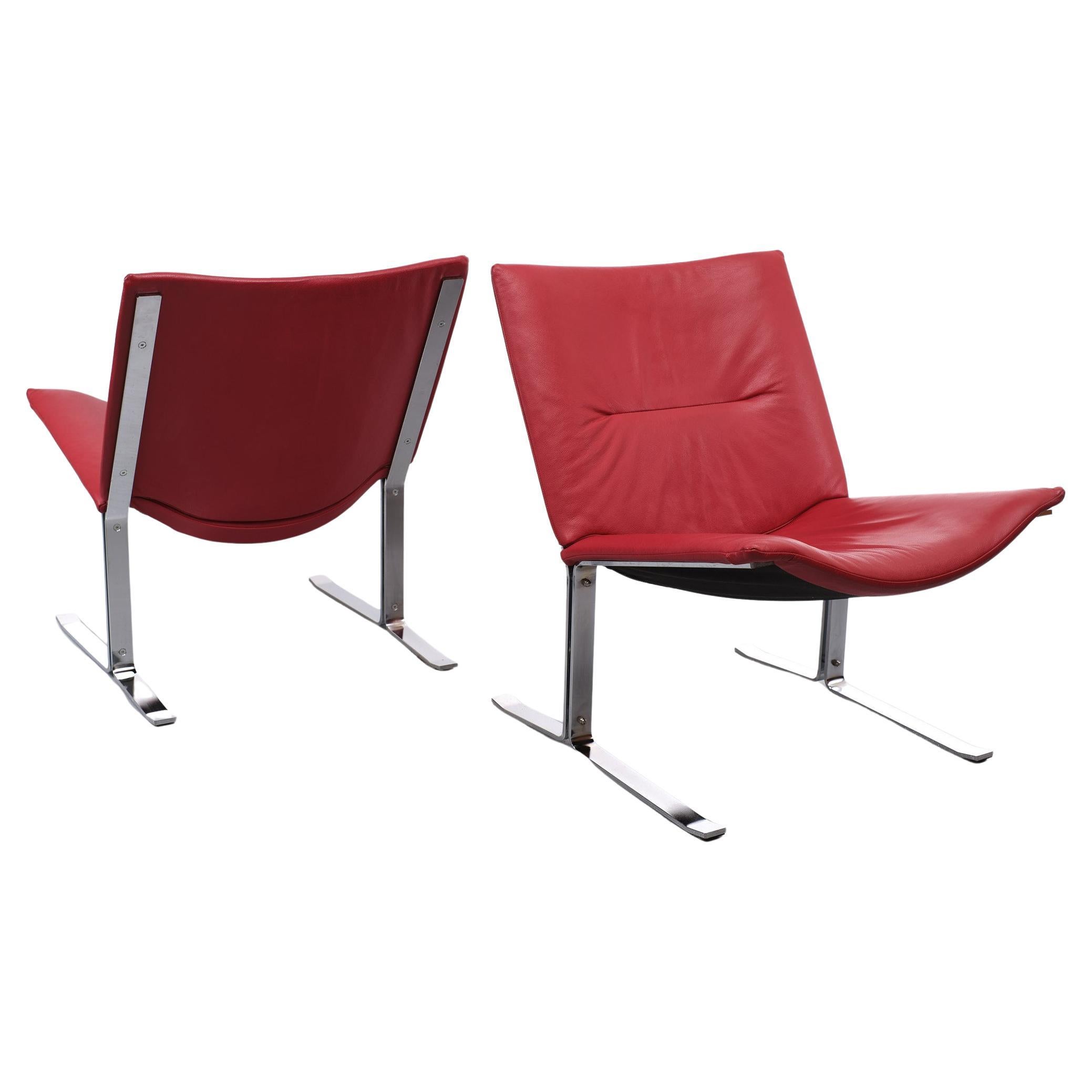 Two beathiful Red Leather lounge chairs. comes on a Chrome base. 
Very nice color. Good seating comfort. and good condition.