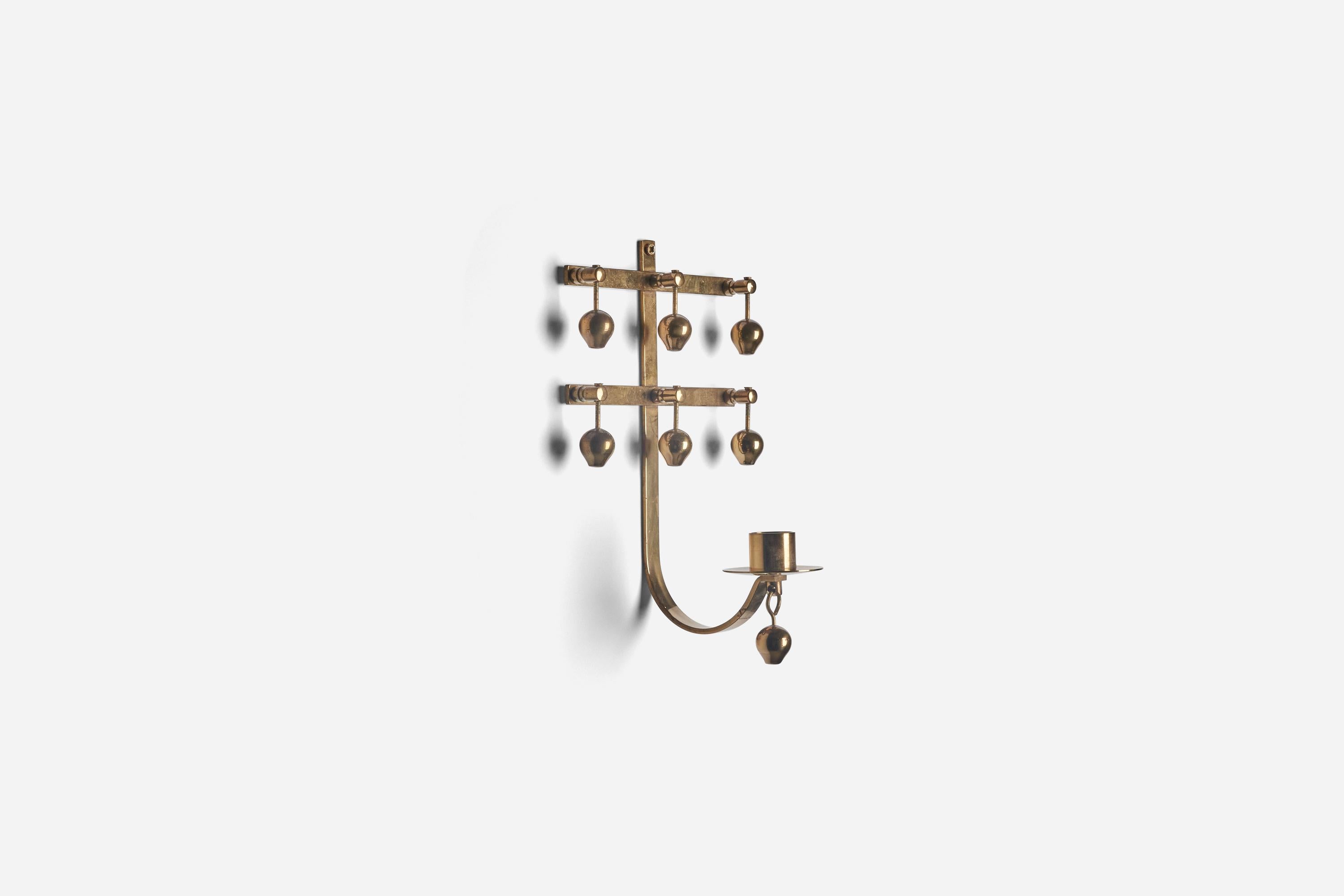 A pair of brass wall candleholders designed and produced by Kee Mora, Brass, Sweden, 1960s.
 
  