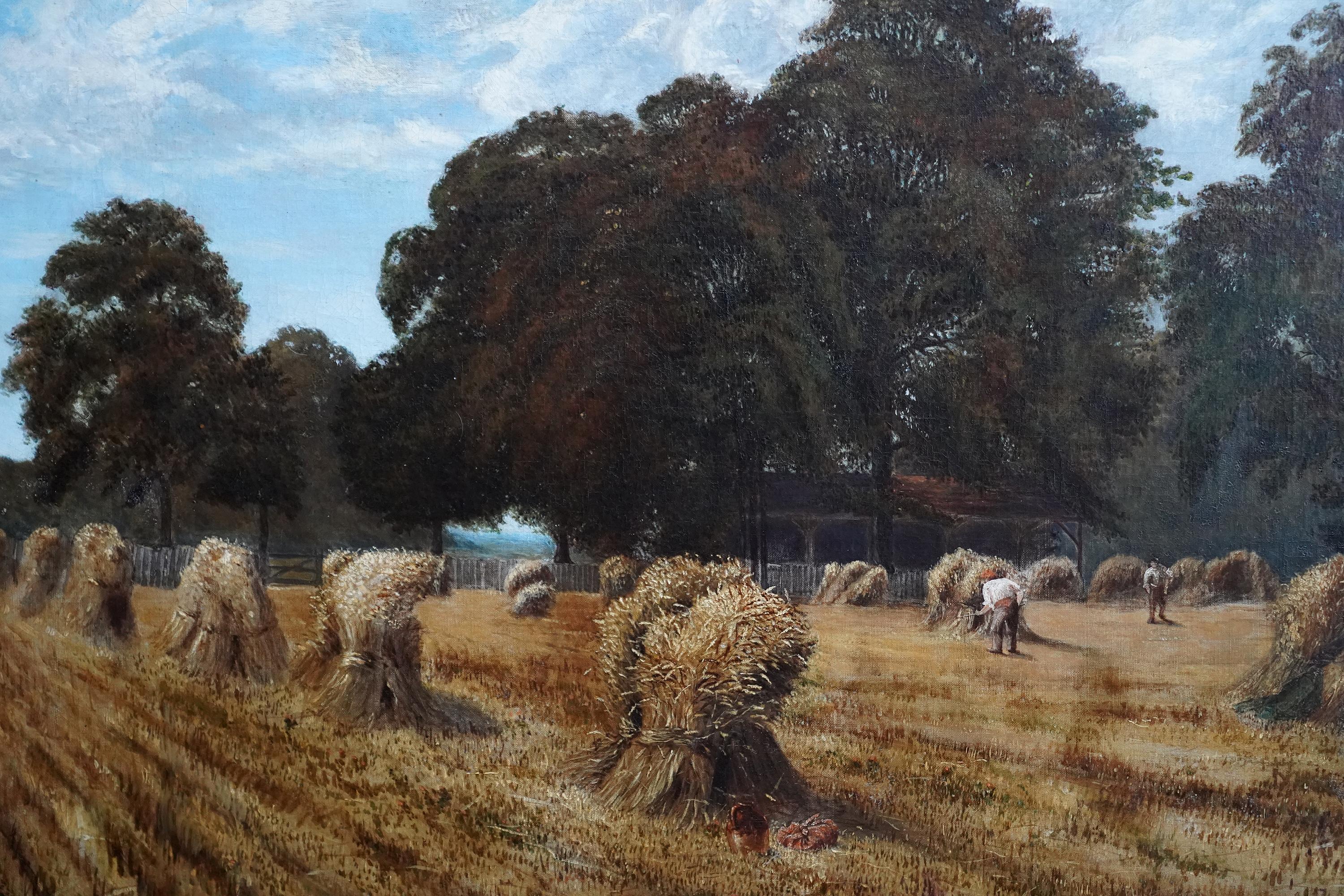 This lovely British Victorian landscape oil painting is by attributed to artist Keeley Halswelle. Painted in 1883 it is a large harvest scene with wheat sheaves in a field in the foreground and labourers working. The field is lined with tress and