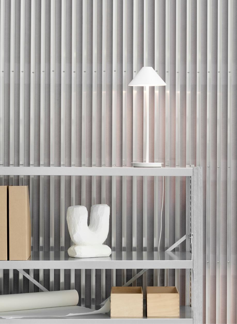'Keglen' table lamp for Louis Poulsen in White.

Keglen was created by Big Ideas in collaboration with Louis Poulsen in 2017. 
Bjarke Ingels, Jakob Lange and the design team from BIG Ideas wanted to create a family of lamps with the same