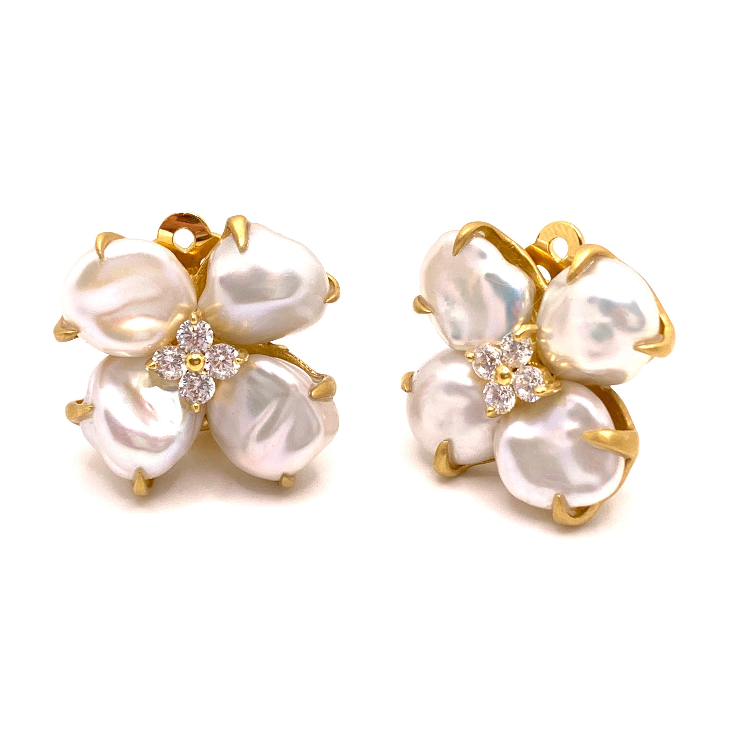 4-petal Keishi Pearl Blossom Flower Clip-on Earrings

These beautiful flower earrings features lustrous cultured Japanese Keishi pearls as petal adorned with round simulated diamonds, handset in 18k yellow gold vermeil over sterling silver, and