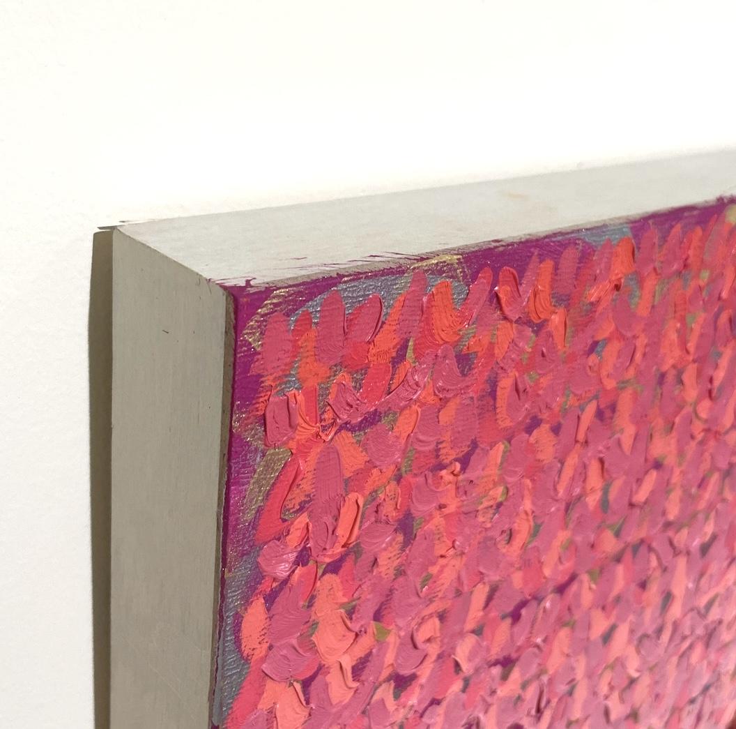 This is a smal, abstract oil painting in gradations of pink with hints of gold undertones by professional artist Keith Breitfeller. Breitfeller’s peaceful, meditative color studies begin with a bright, dynamic under-painting in acrylic, which can