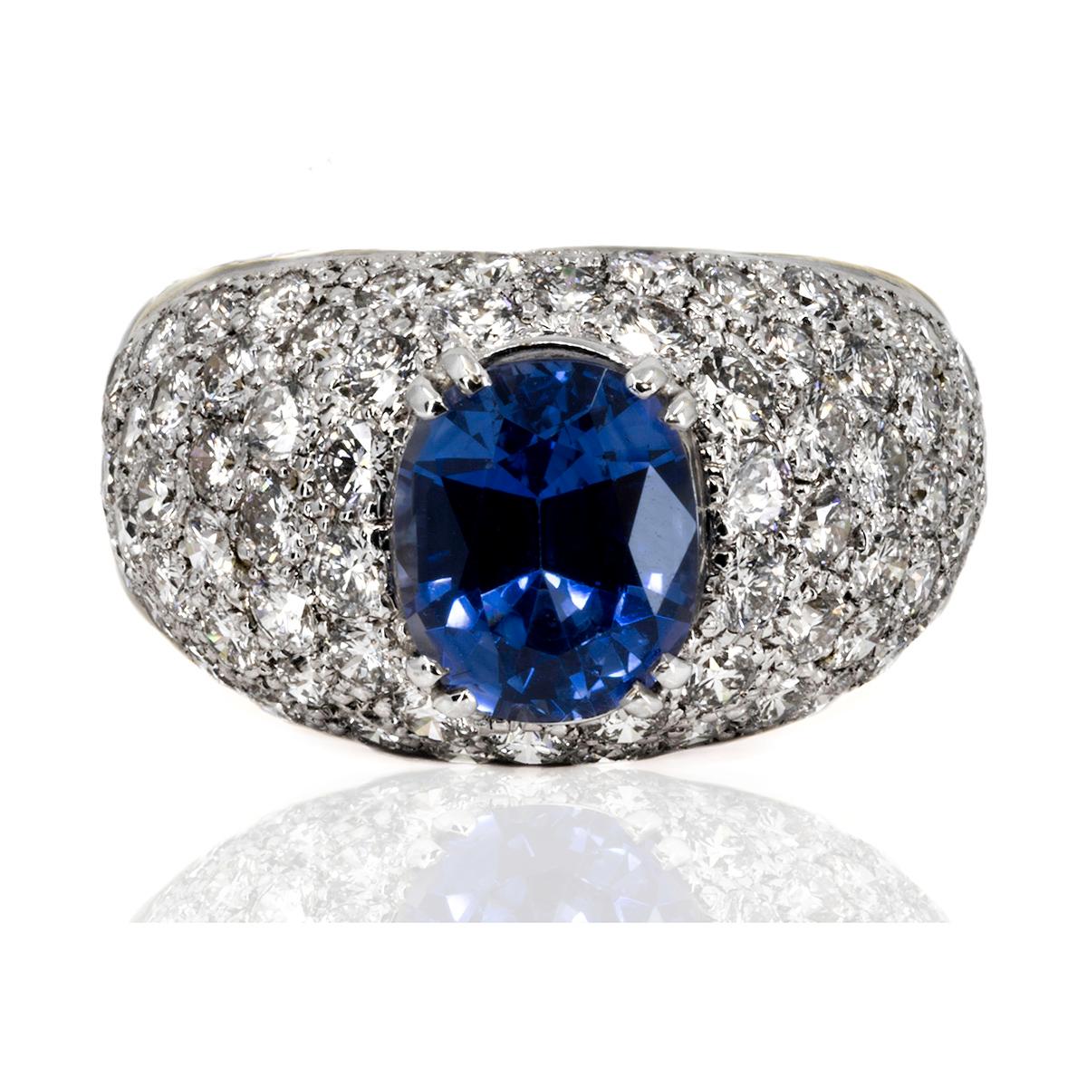 Hand Fabricated 18k Ring by Keith Davis for Thayer Jewelers. Containing one Ceylon sapphire weighing 2.88 carats and 76 pave set round brilliant diamonds weighing 3.03 carats. 

Keith Davis  Before coming to the United States to do specialized