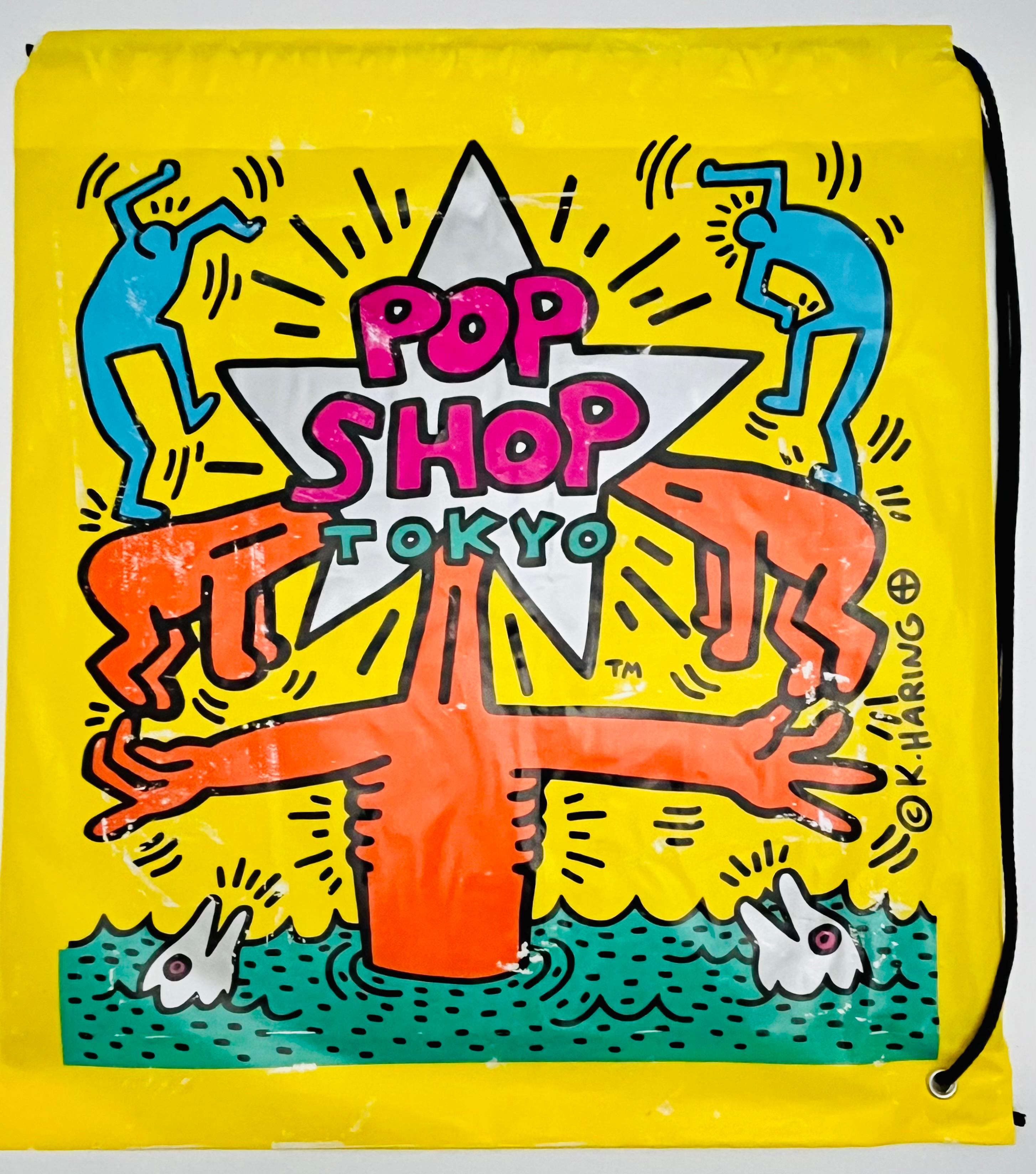 Keith Haring Pop Shop Tokyo 1988:
Rare vintage original 1980s Keith Haring Pop Shop Tokyo bag designed & illustrated by the artist. Features a bold Keith Haring printed signature and standout original Haring Pop shop Tokyo logos, plus bright, lush