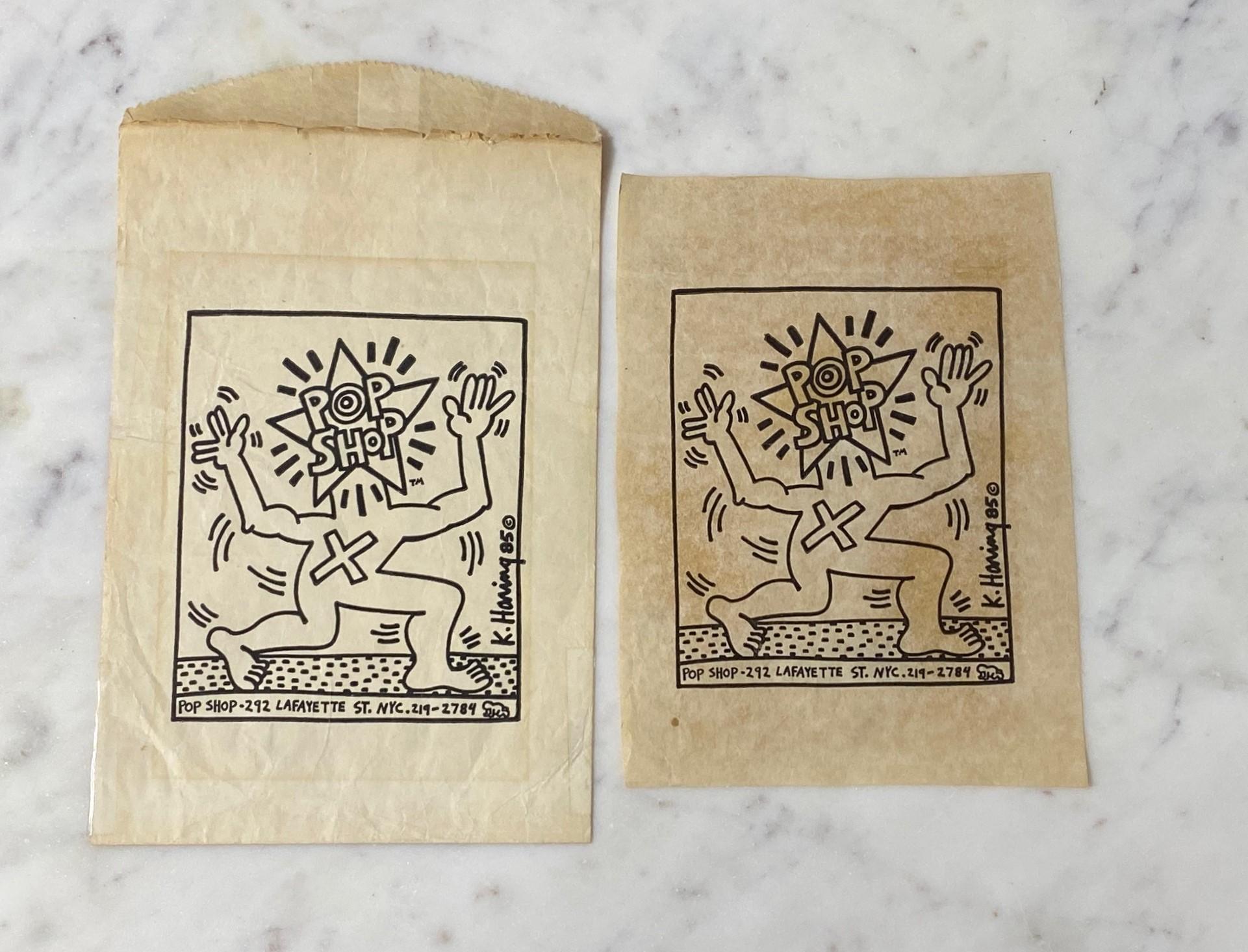 A very cool vintage 1980s NYC Pop Shop store bag which was illustrated by Keith Haring.  Few of these original shopping bags exist today.  

The now collectible bags were done as an offset lithograph on white paper and would look great once