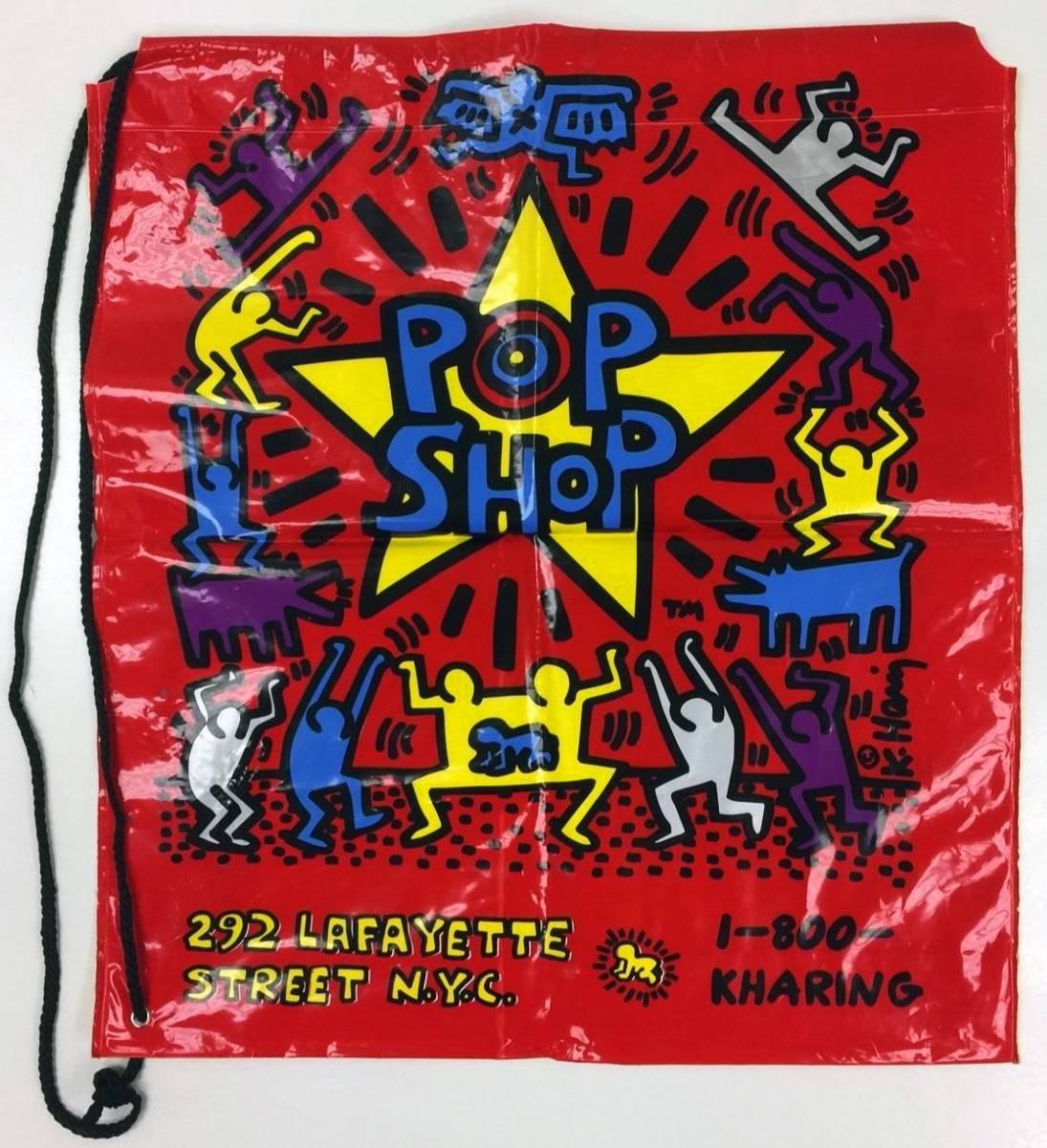 Vintage Keith Haring Pop Shop bag
Fantastic double-sided frame piece rich with color. Features a bold haring printed signature on lower right of front as well as the iconic Haring Pop Shop logo. 

Some minor wear commensurate with medium;