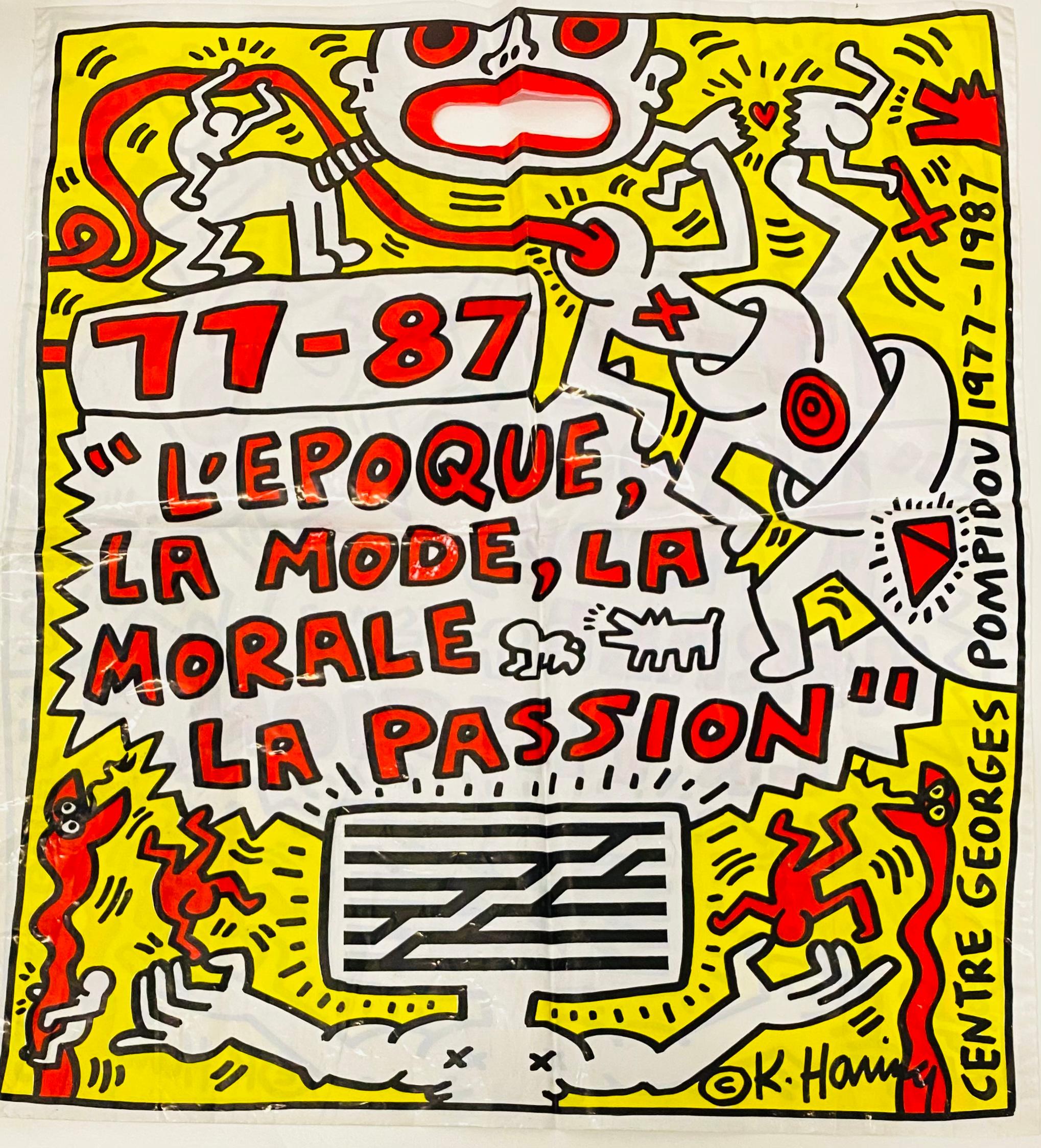 Keith Haring Paris, 1987:
Well-suited for framing, this vibrant oversized illustrated bag was designed by Keith Haring during his lifetime for the Pompidou exhibit:

L’Epoque, La Mode, La Morale, La Passion: Aspectsde l’Art d’ Aujourd’hui,