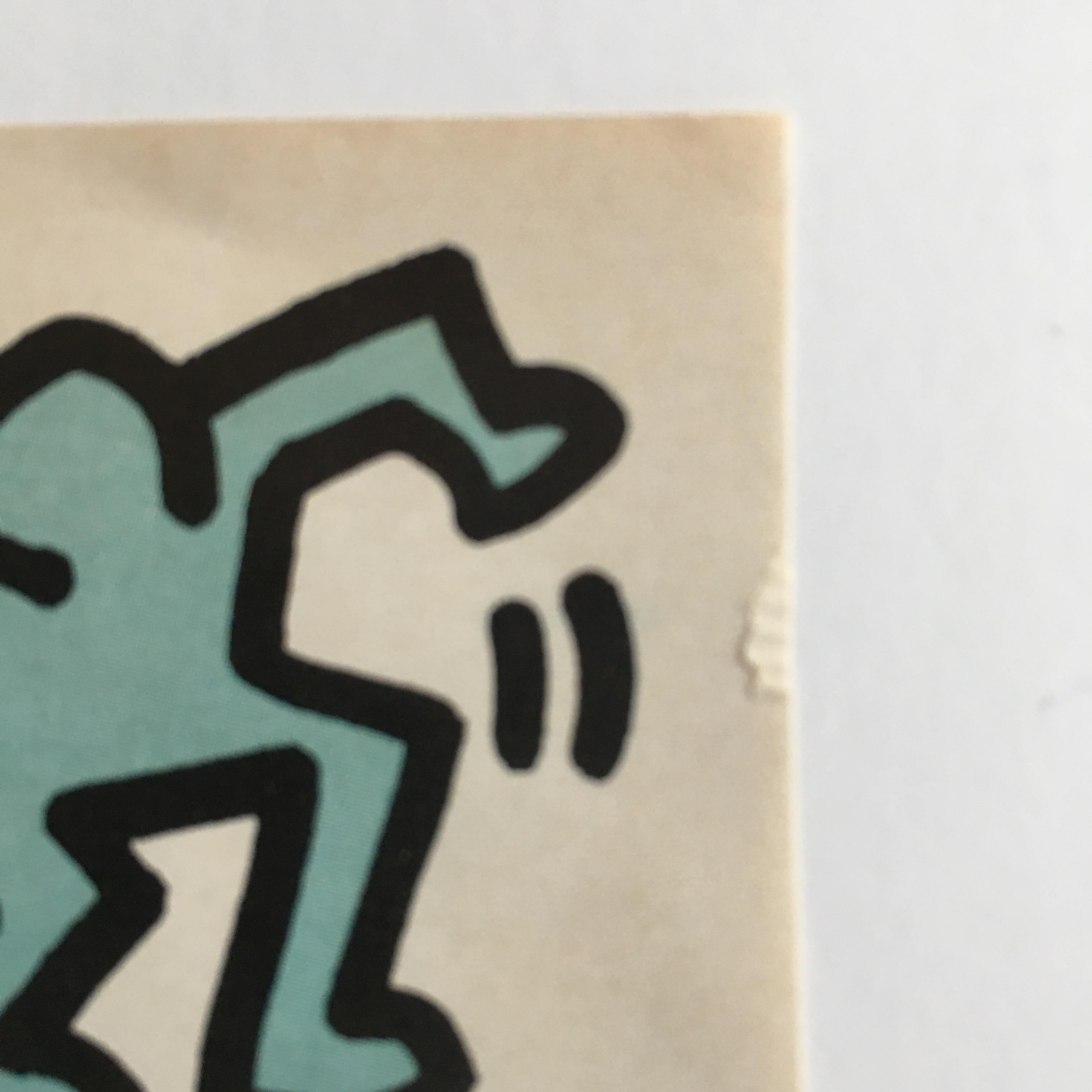 Keith Haring (American 1958-1990) 
Swatch Advertisement 
Offset advertisement print 
Signed in plate/print. Also hand signed and dated in marker upper right corner: K. Haring 86; with 'crawling baby' artist tag next to the signature. 
Sheet: 15 1/4
