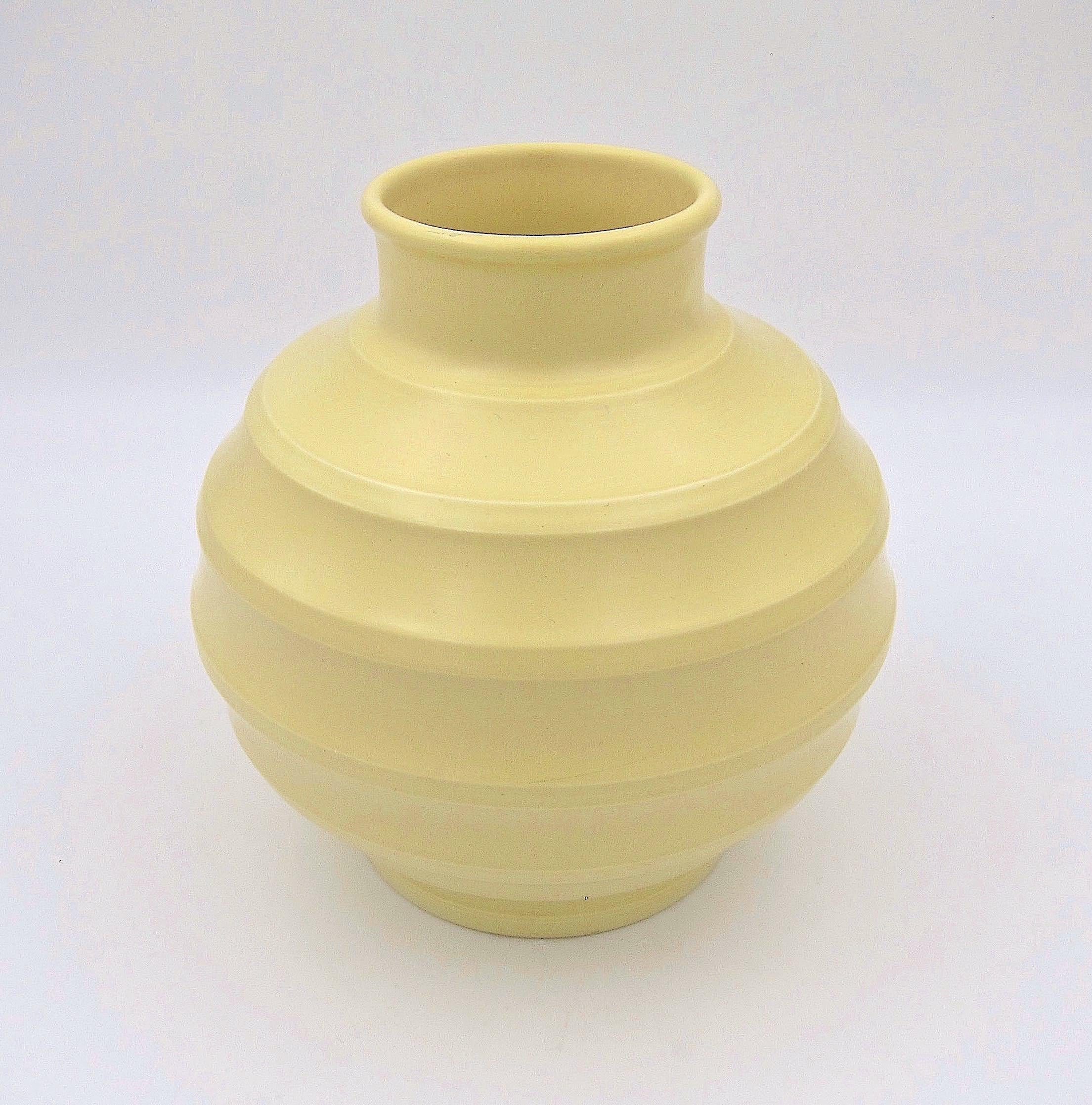 A spherical Art Deco vase by New Zealand born architect, potter, and designer, Keith Murray (1892-1981) for Wedgwood of England, dating to the 1940s. Murray designed this vase in 1932 and his 