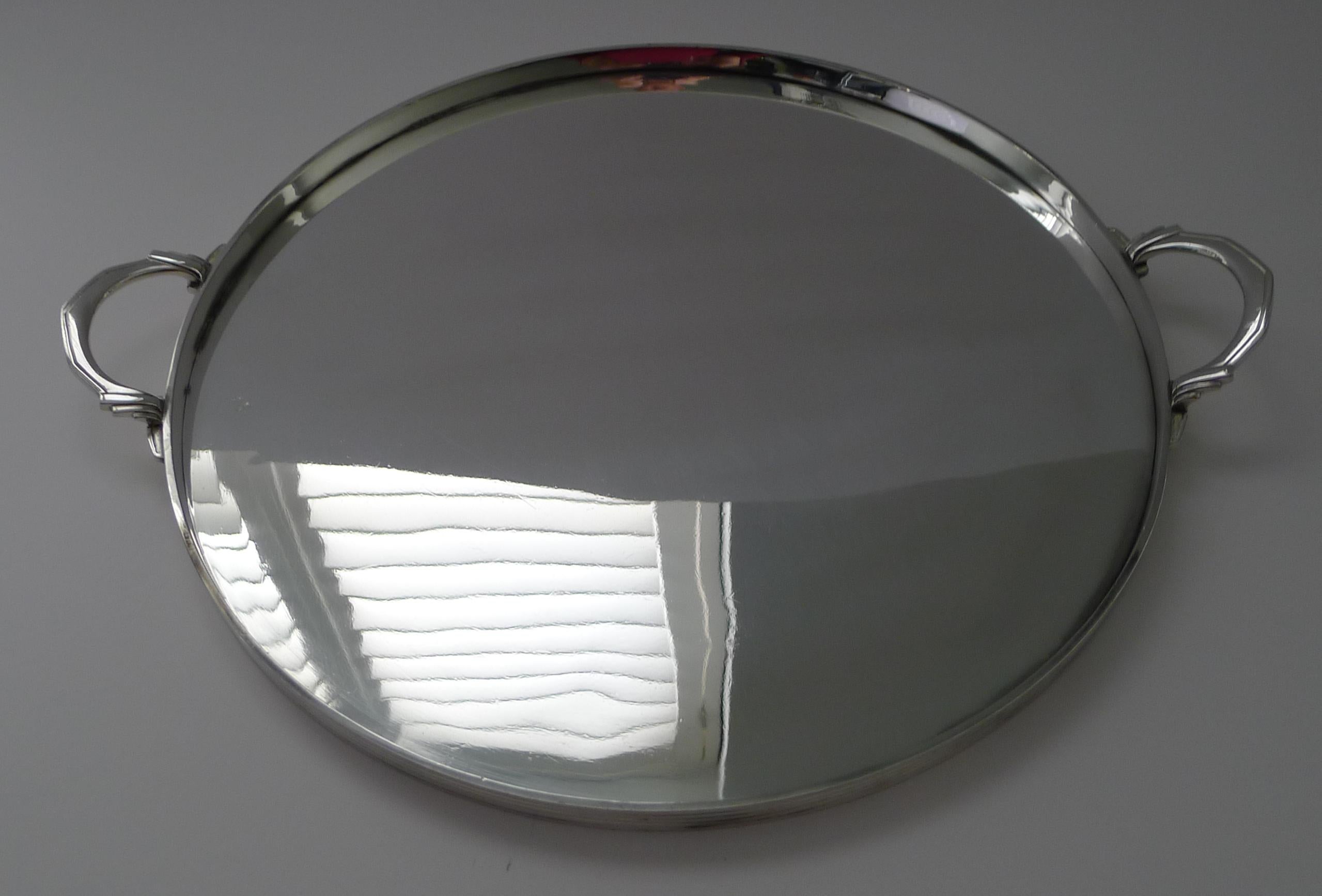 A stunning and scarcely found Art Deco handled tray, perfect of the finest bar with it's circular tray with straight sides with linear details and finished with two stylish handles.

Just back from our silversmith's, it has been professionally