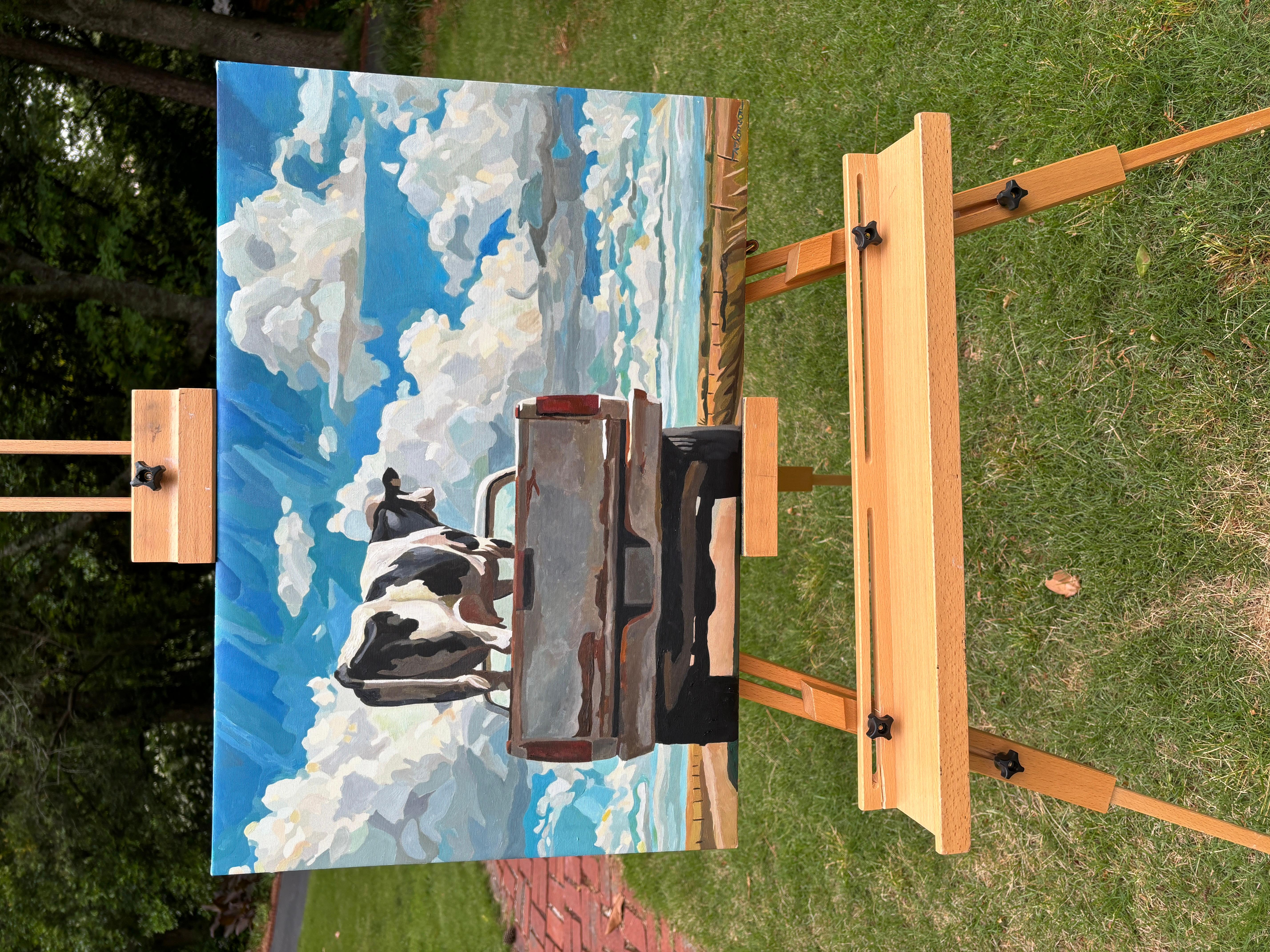 <p>Artist Comments<br>A whimsical rural scene unfolds as a Holstein named Ella from Elmore County, Alabama, stands proudly on the bed of an old pickup truck. It drives beneath a vast sky filled with voluminous clouds. The cow, who earned second